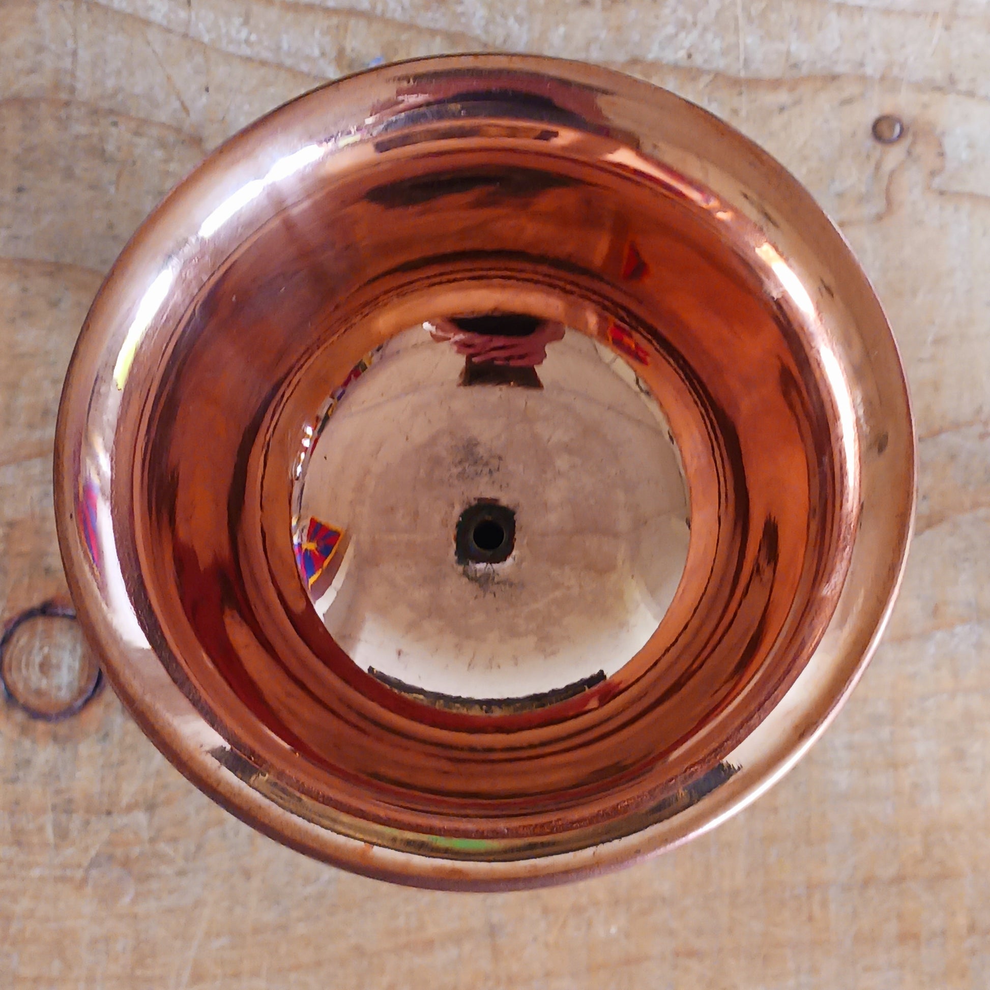 Illuminate your sacred space with this Large Copper Butter Lamp, beautifully handcrafted and engraved with traditional Tibetan auspicious symbols around the sides. Commonly used in Tibetan temples, these lamps are filled with yak butter, vegetable oil, or ghee and offered as a light to symbolize wisdom and clarity. Each morning, Tibetan Buddhists light butter lamps as a spiritual act of devotion and illumination. Perfect for altars, meditation spaces, or as a unique cultural centerpiece, this lamp brings bo