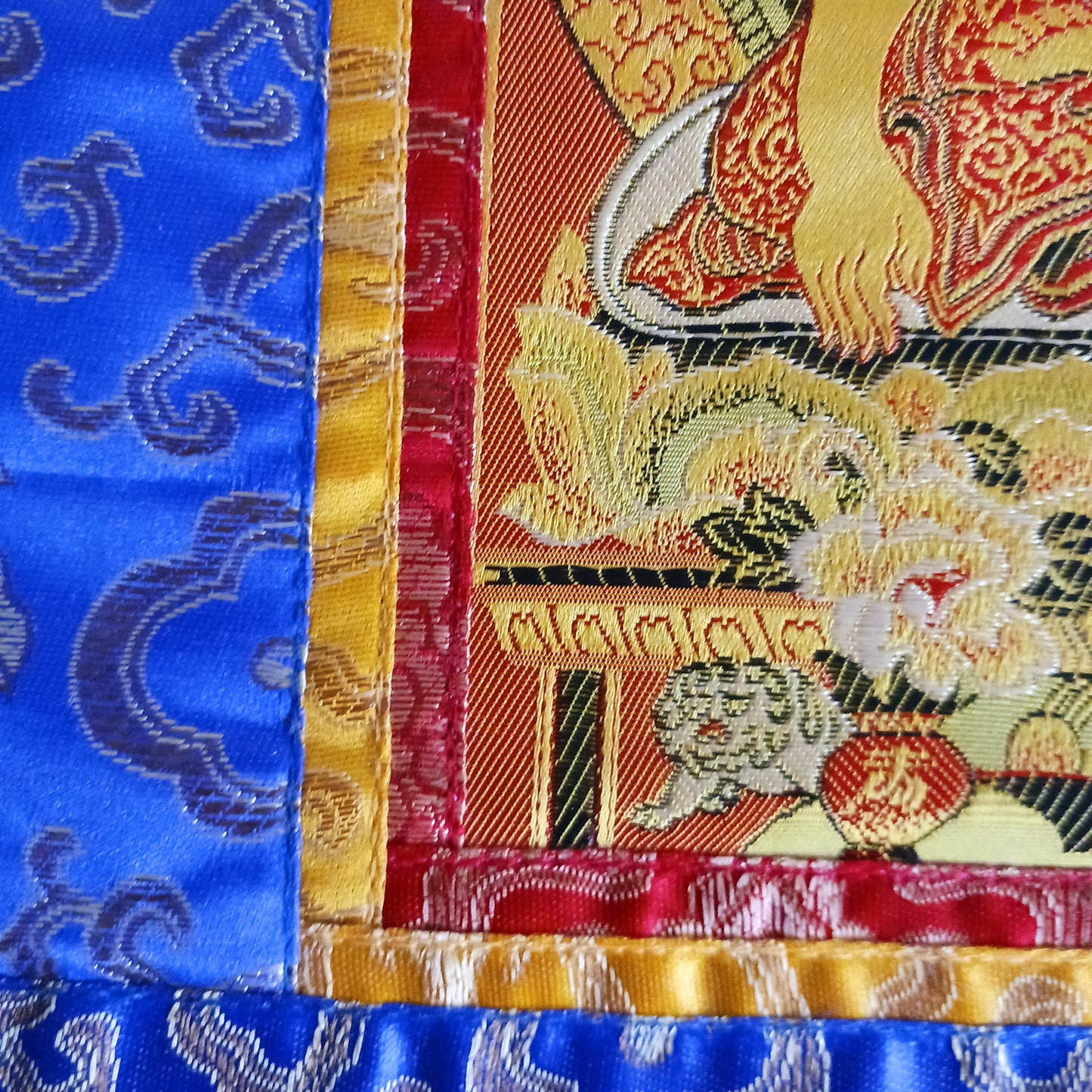 Bring serenity, beauty, and spiritual inspiration into any space with this Handmade Embroidered Buddha Thangka, crafted by skilled artisans in Nepal. Each piece is created using traditional techniques passed down through generations, featuring intricate embroidery and a rich brocade border that highlights the calm and compassionate presence of the Buddha.