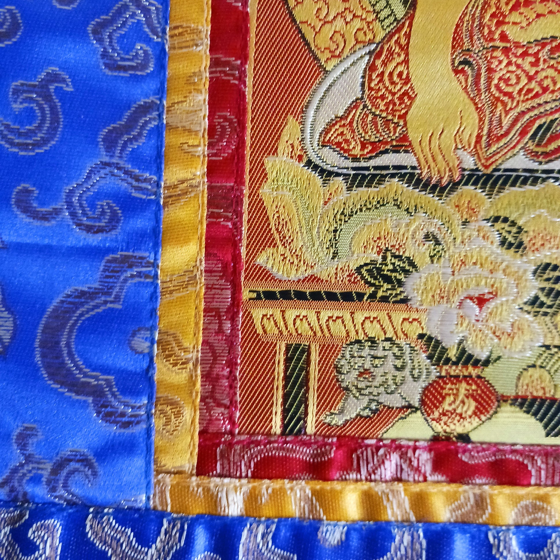 Bring serenity, beauty, and spiritual inspiration into any space with this Handmade Embroidered Buddha Thangka, crafted by skilled artisans in Nepal. Each piece is created using traditional techniques passed down through generations, featuring intricate embroidery and a rich brocade border that highlights the calm and compassionate presence of the Buddha.