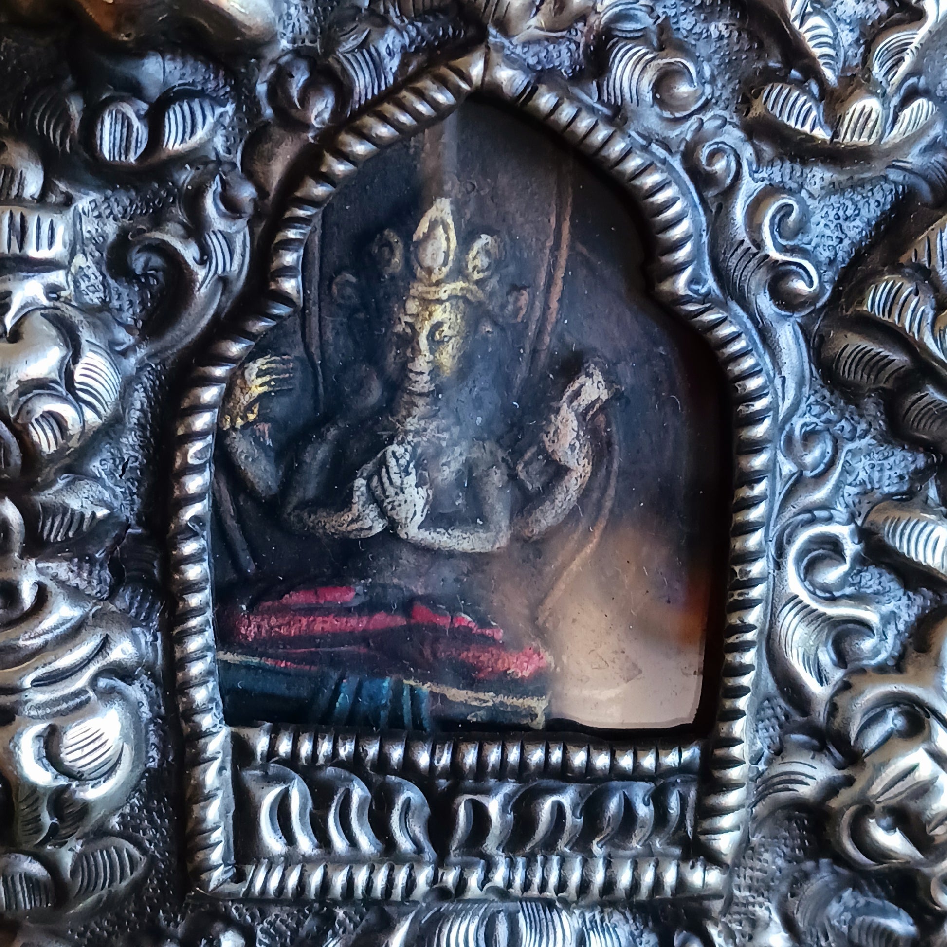 Discover the spiritual power of the Tibetan Ghau, a portable shrine and traditional prayer box used to carry sacred relics, charms, and medicinal herbs. Crafted by skilled Tibetan refugee artisans in Nepal, each Ghau serves as a portable shrine offering protection and blessings during travel. Wear it as a pendant around your neck or hang it from a waist sash or belt. This handcrafted piece is not only a spiritual talisman but also a beautiful work of art, connecting you to centuries-old Tibetan traditions.