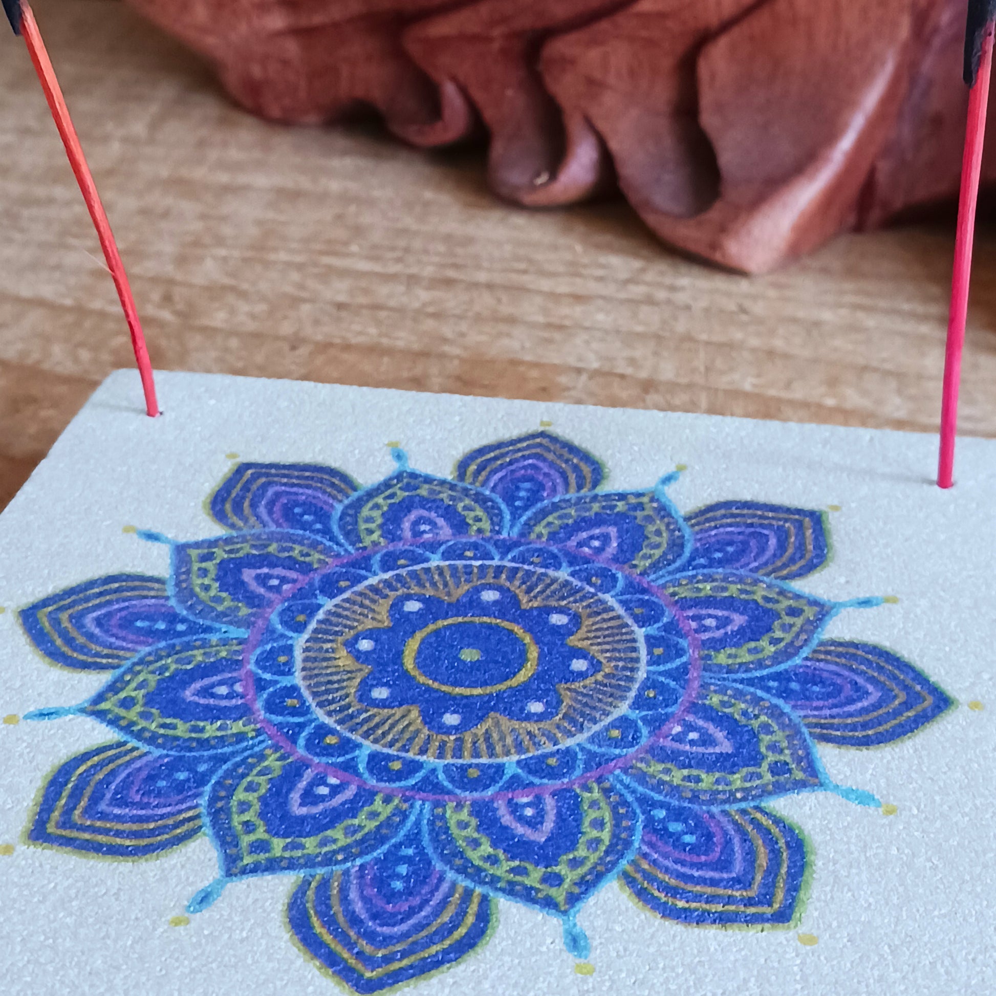 Bring tranquillity and artistic beauty into your space with this handcrafted sandstone incense burner, featuring a vibrant purple mandala print. The natural weight and texture of the sandstone ensure stability while burning your favourite incense, and the detailed mandala design adds a calming, spiritual touch to any room.