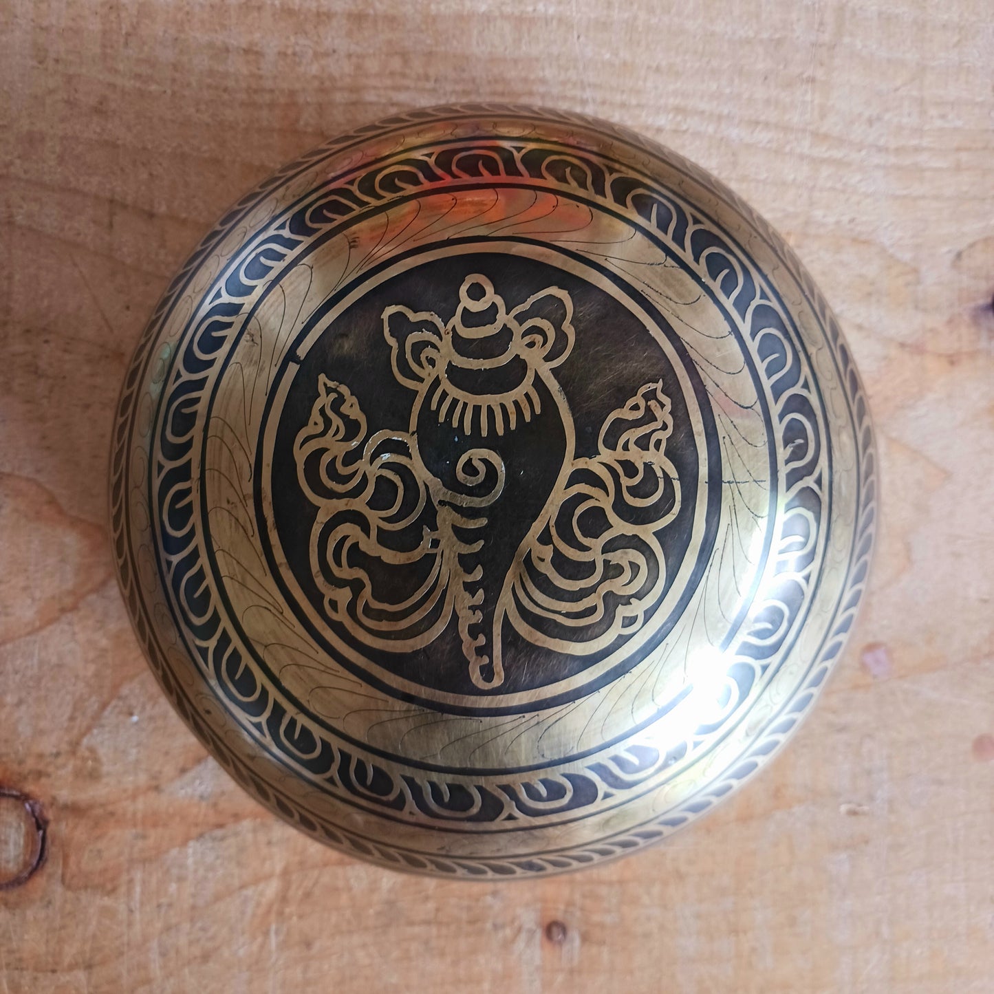 This beautifully crafted Tibetan Singing Bowl is machine made and delicately etched with the sacred Om Mantra, symbolizing universal connection and inner peace. Each bowl is unique in its artistry and design. Traditionally used for meditation and healing, singing bowls help restore harmony between body, mind, and soul.