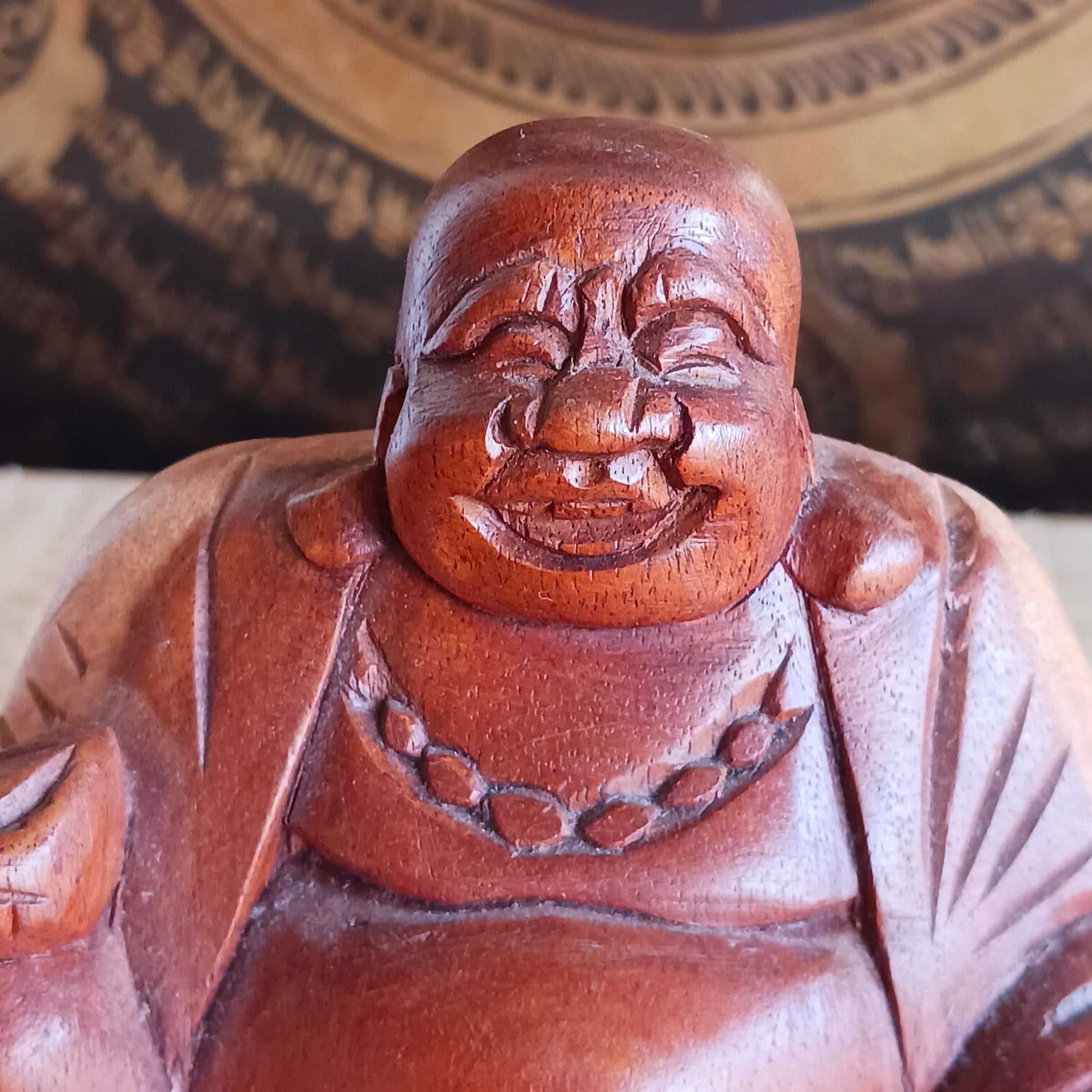 Bring joy and good fortune into your space with this exquisite little hand-carved Laughing Buddha statue. Known as Budai in Chinese culture, this beloved figure represents contentment, abundance, and spiritual well-being.