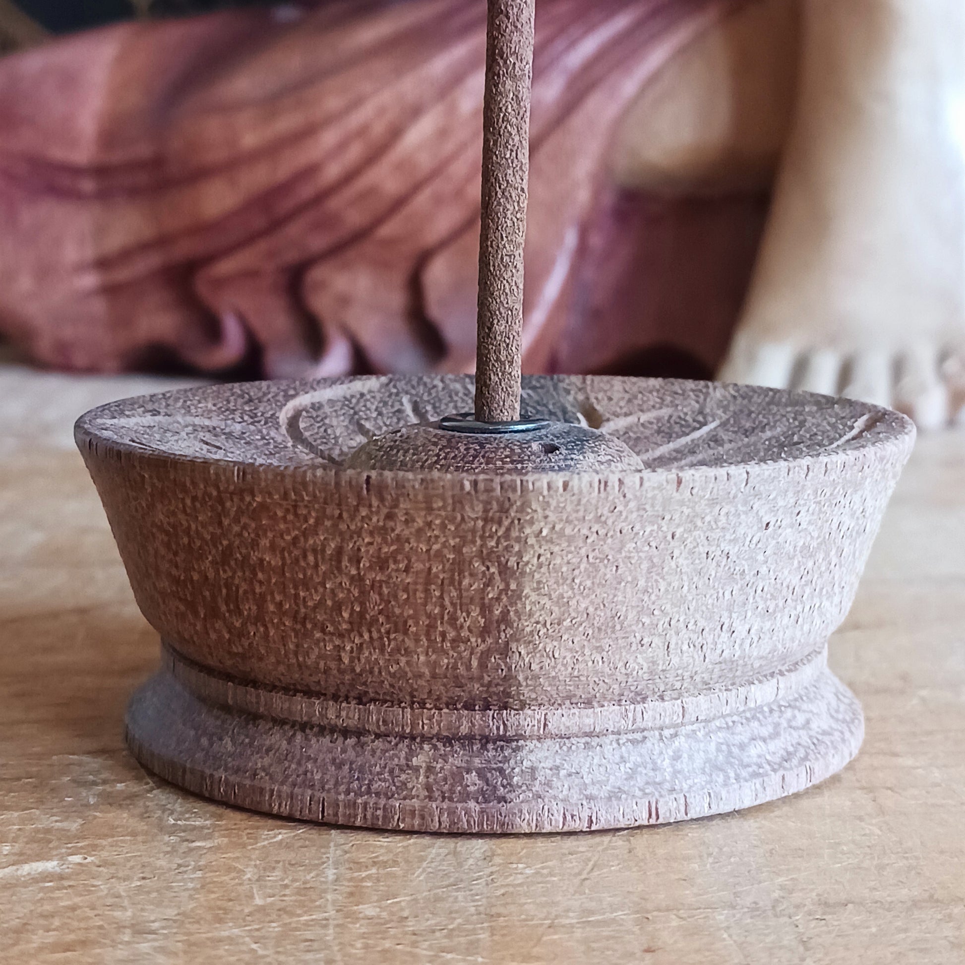 Hand-carved with reverence and skill, this Lotus Flower Incense Holder is made from a single piece of Nepalese wood. Its elegant lotus flower design symbolizes the blossoming of inner peace through mindful living.