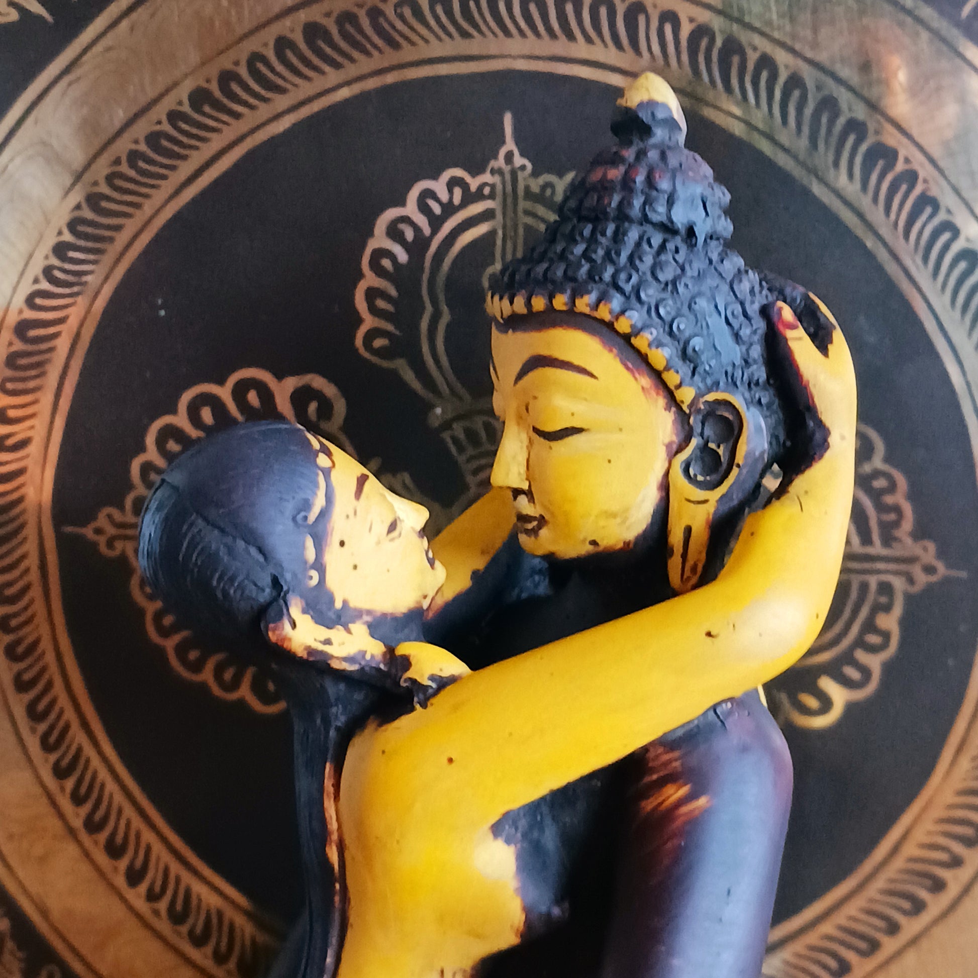 Discover a uniquely crafted Buddha and Shakti Embracing Statue, cast in high-quality resin and hand-painted in rich maroon and yellow tones. Sculpted by skilled Nepalese artisans, this extraordinary piece portrays the sacred union of Samantabhadra and his consort—a symbolic representation of harmony, balance, and the inseparable connection between wisdom and compassion.