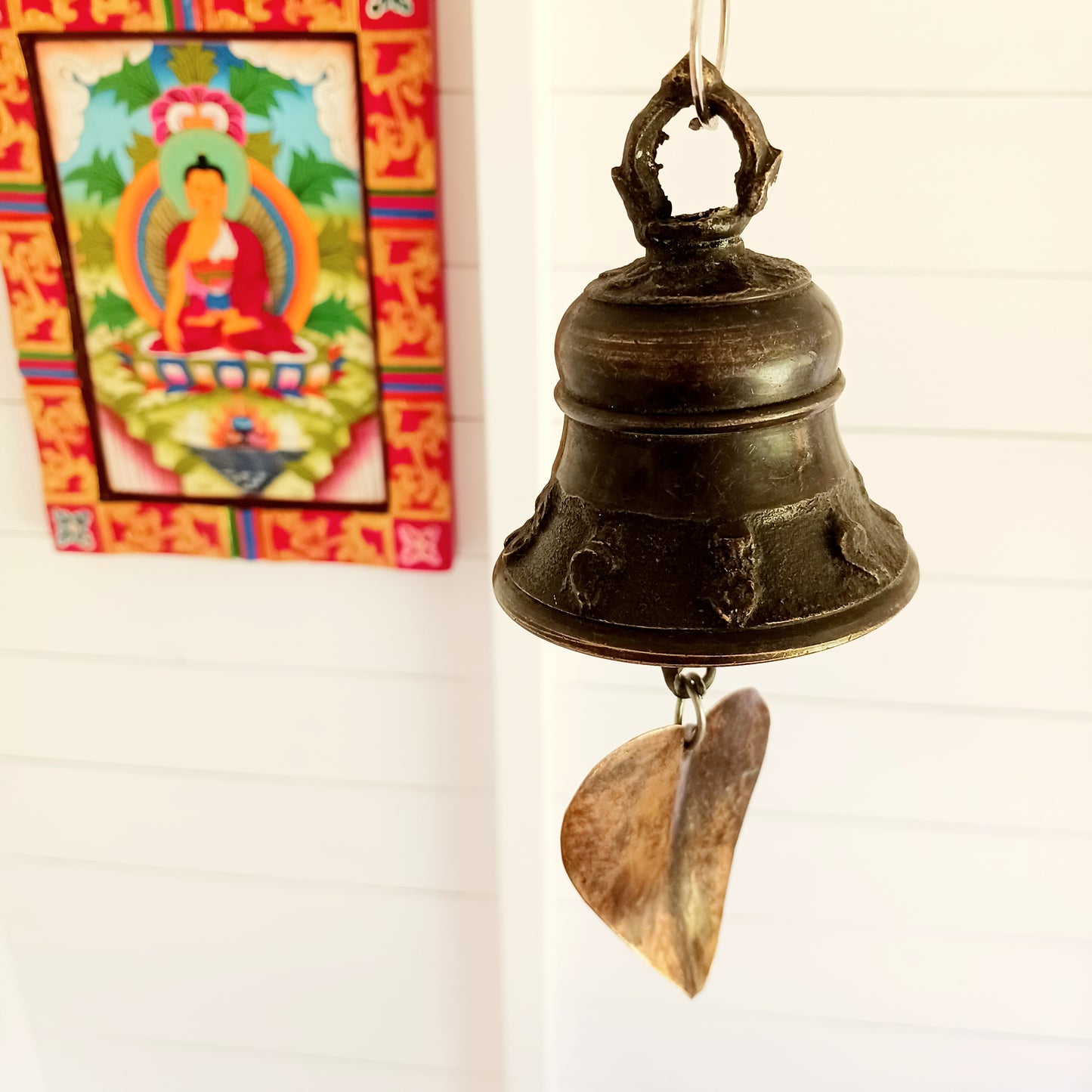 Bring a sense of peace and tradition to your home or garden with this beautifully handcrafted Brass Temple Hanging Bell with Bodhi Leaf. Made by skilled artisans in Nepal using traditional techniques, this elegant bell features a classic temple bell design paired with a decorative brass Bodhi leaf, a symbol of wisdom, enlightenment, and spiritual growth.