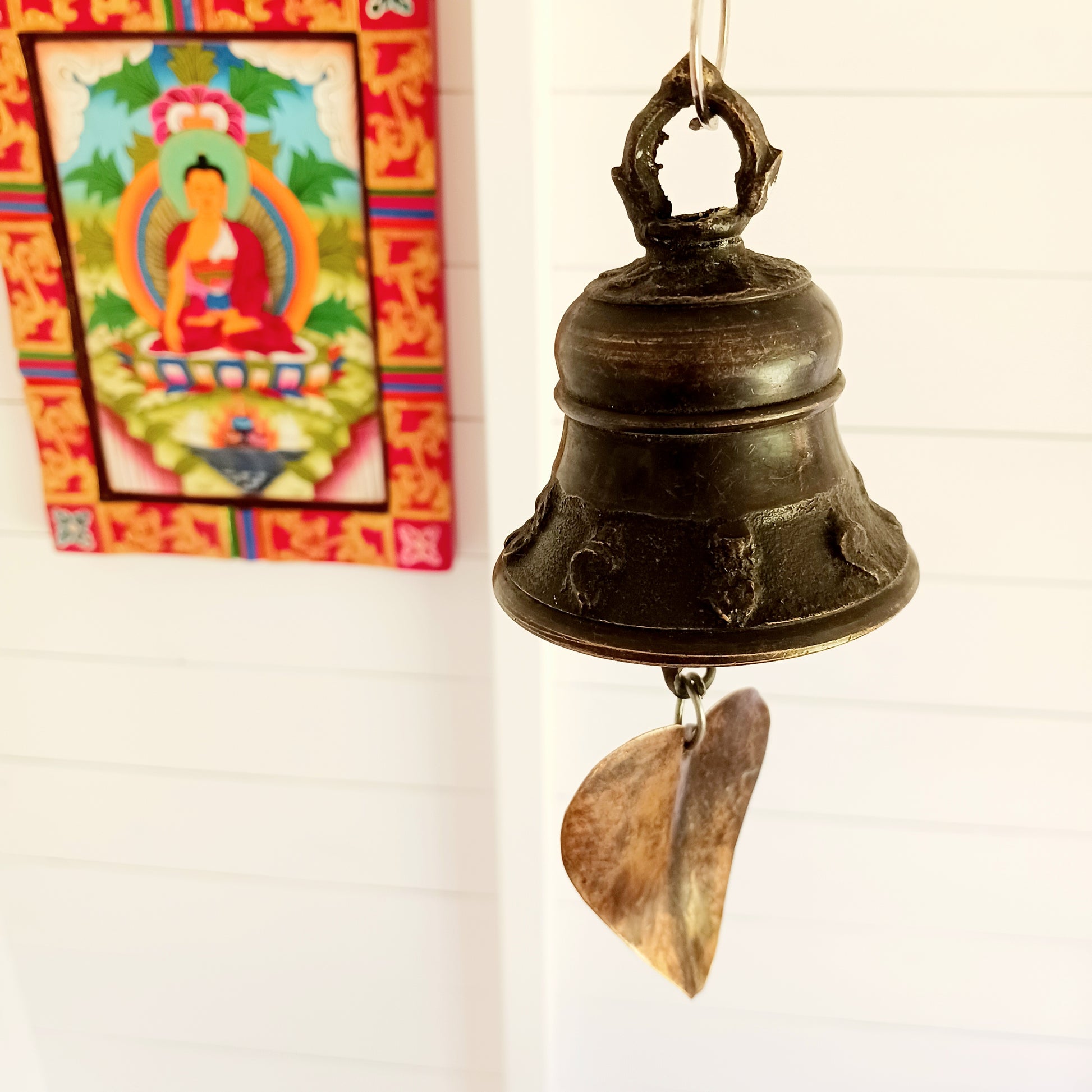 Bring a sense of peace and tradition to your home or garden with this beautifully handcrafted Brass Temple Hanging Bell with Bodhi Leaf. Made by skilled artisans in Nepal using traditional techniques, this elegant bell features a classic temple bell design paired with a decorative brass Bodhi leaf, a symbol of wisdom, enlightenment, and spiritual growth.