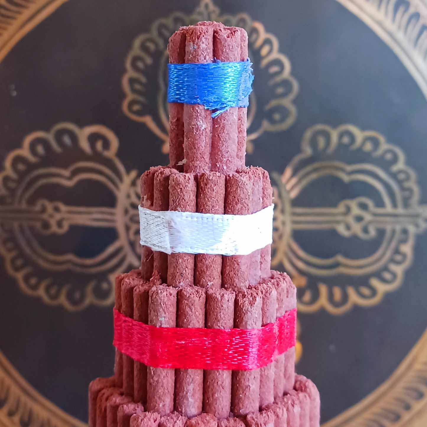 Bring authentic Himalayan tradition to your sacred space with this Buddhist Shrine Tibetan Incense Torma. Handmade in Nepal using the ancient art of incense crafting, each torma is carefully formed from a blend of herbs, fragrant woods, and spices.