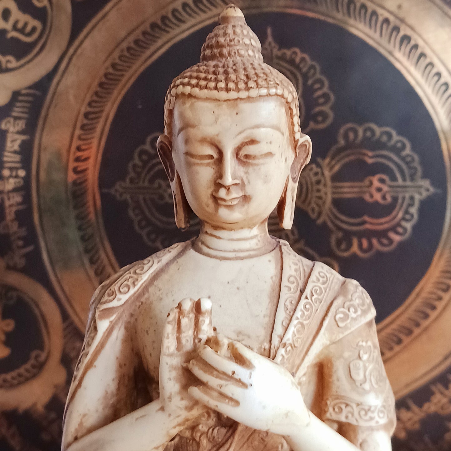 Bring serenity and wisdom into your space with this large, intricately detailed Buddha statue. Cast in a deep sand colour, this statue depicts the Buddha in the Dharmachakra Mudra — the "Wheel of Dharma" gesture. 
