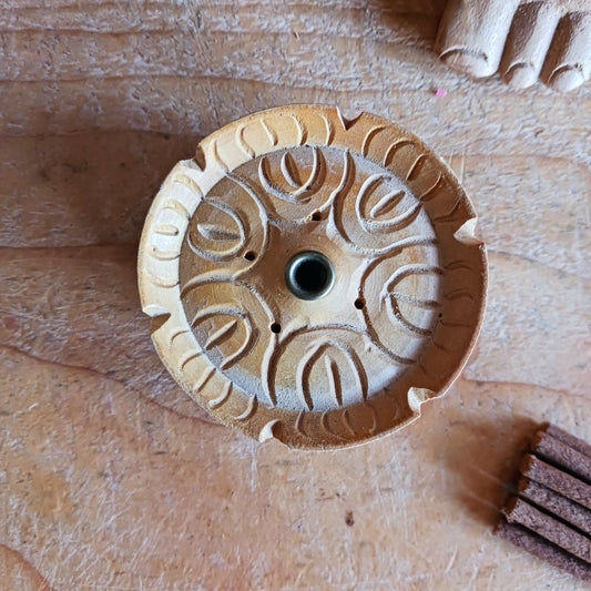 This beloved Lotus Tibetan Incense Holder is a simple yet sacred companion for your incense practice. Hand-carved from a single piece of soft yellow wood in Nepal, each piece carries the gentle energy of mindful craftsmanship and Buddhist symbolism.