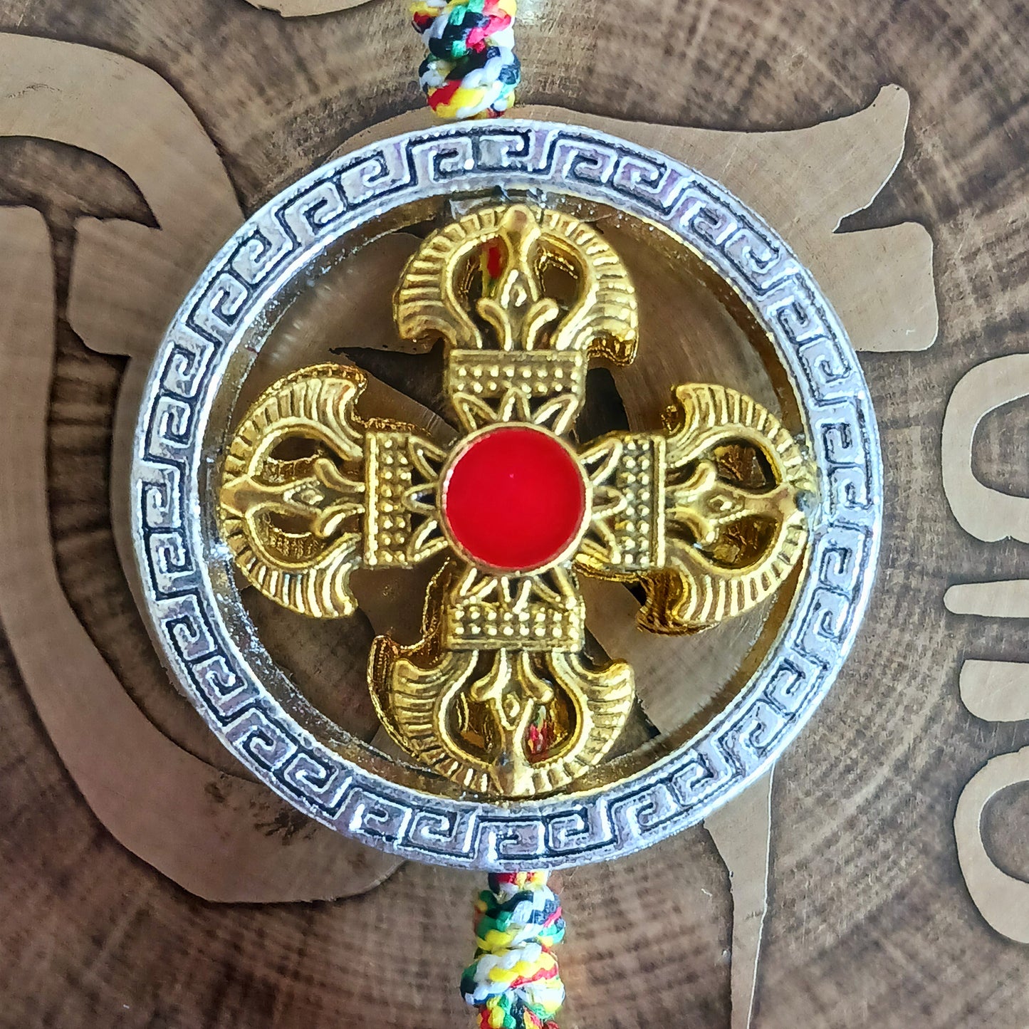 Bring the power of ancient Tibetan symbolism into your daily life with this handcrafted Buddhist protective pendant. Featuring the Double Dorje, a symbol of unwavering stability and protection from fear, and the Kartika, a ritual blade representing the cutting away of ignorance and attachment, this versatile charm can be hung in your car, placed in your home, or attached to your bag or key ring