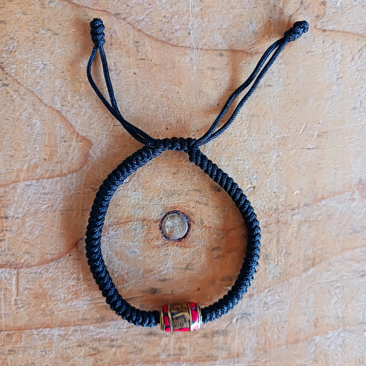 Experience the timeless beauty and spiritual symbolism of this handcrafted Tibetan Mantra Rope Bracelet. Each bracelet is skilfully woven with high-quality braided cord, designed to be durable, lightweight, and comfortable for daily wear.
