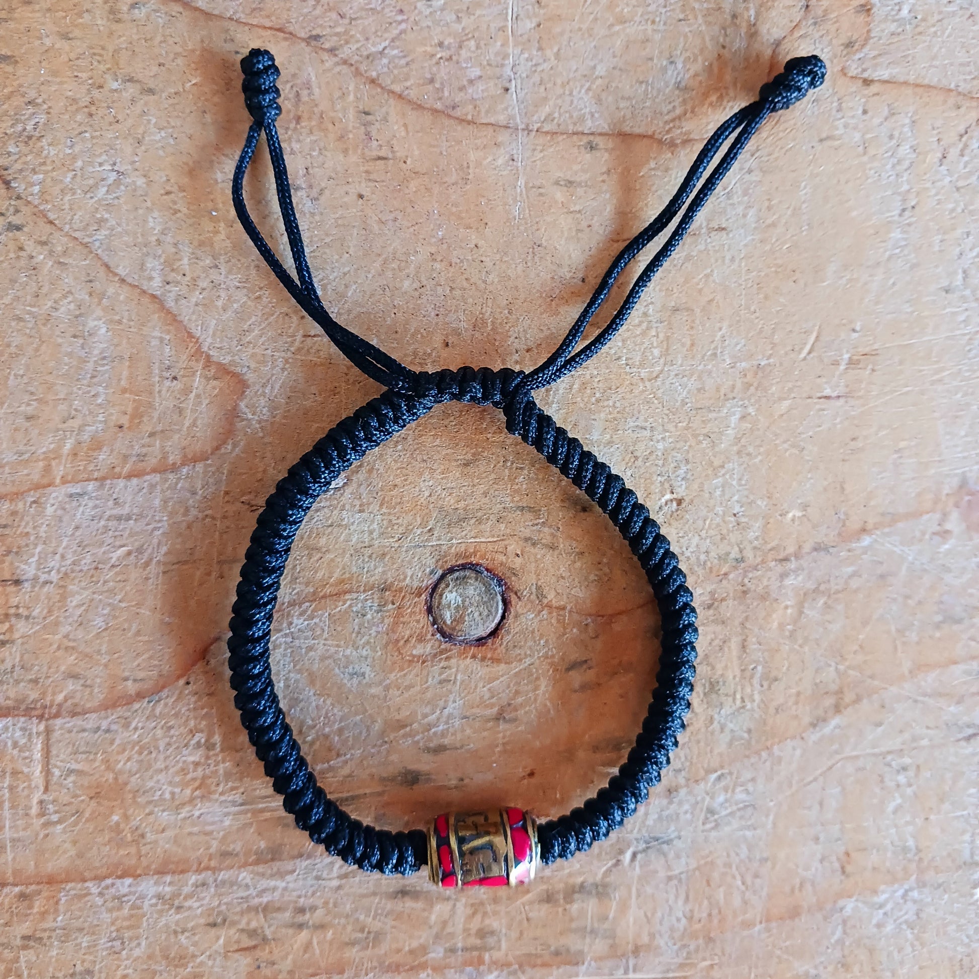 Experience the timeless beauty and spiritual symbolism of this handcrafted Tibetan Mantra Rope Bracelet. Each bracelet is skilfully woven with high-quality braided cord, designed to be durable, lightweight, and comfortable for daily wear.