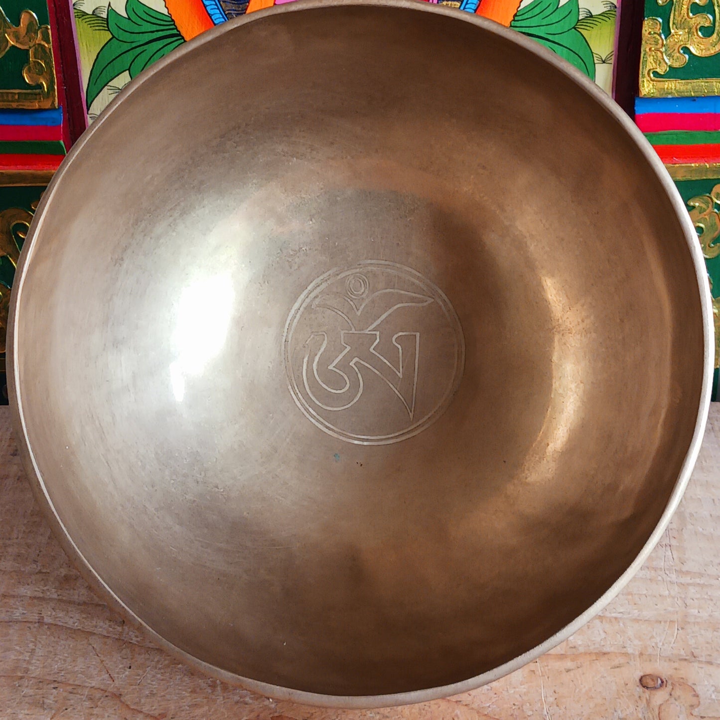 Elevate your meditation and sound healing practice with this Classic Hand-Hammered Singing Bowl, beautifully engraved with the sacred OHM symbol inside the bowl. This is a unique, one-of-a-kind item—you will receive exactly the bowl pictured.