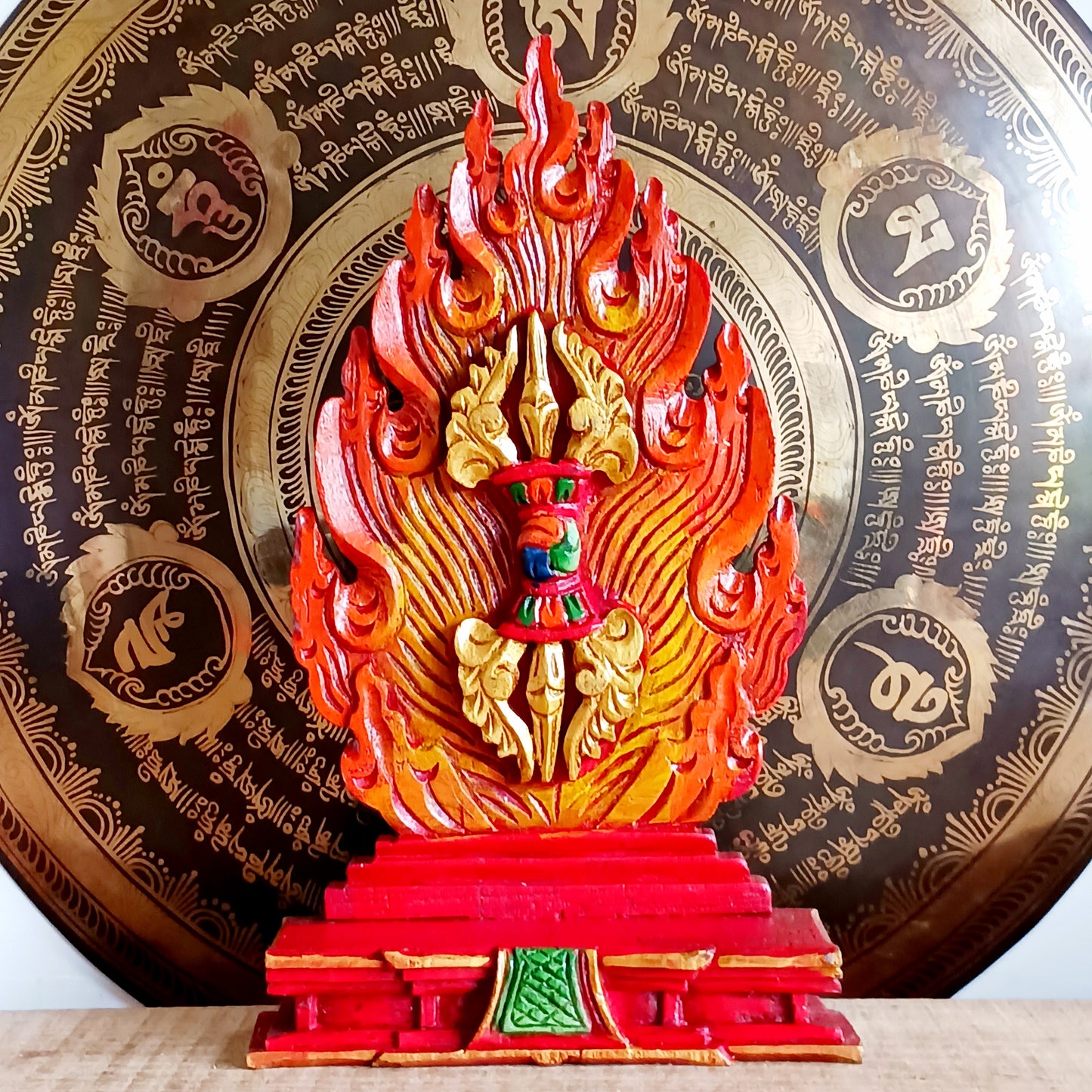This handcrafted wooden Tibetan Altar decoration stands as a testament to skilled artistry. It has been carefully carved and painted into a beautiful creation.