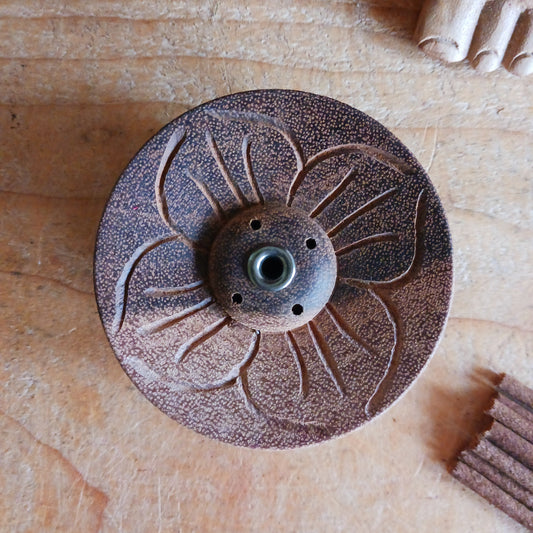 Hand-carved with reverence and skill, this Lotus Flower Incense Holder is made from a single piece of Nepalese wood. Its elegant lotus flower design symbolizes the blossoming of inner peace through mindful living.