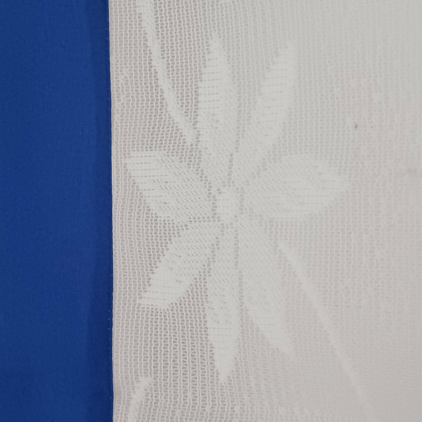 Bring spiritual harmony and traditional Himalayan craftsmanship into your home with this handmade Tibetan Buddhist Endless Knot Door Curtain. Crafted in a white fabric, this semi-transparent curtain allows natural light to pass through, creating a warm and calming atmosphere.