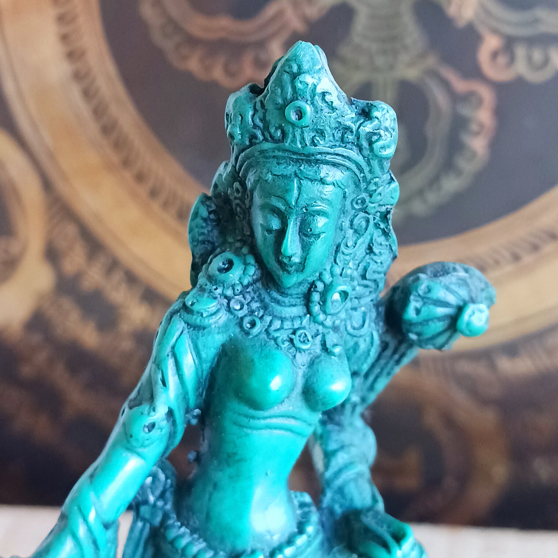 Honour the presence of compassion, protection, and enlightened wisdom with this beautifully hand-painted resin statue of Green Tara. Representing one of the 21 revered forms of Tara, this statue depicts her in a graceful standing posture, hands in the varada mudra—the gesture of generosity, blessing, and compassionate offering.