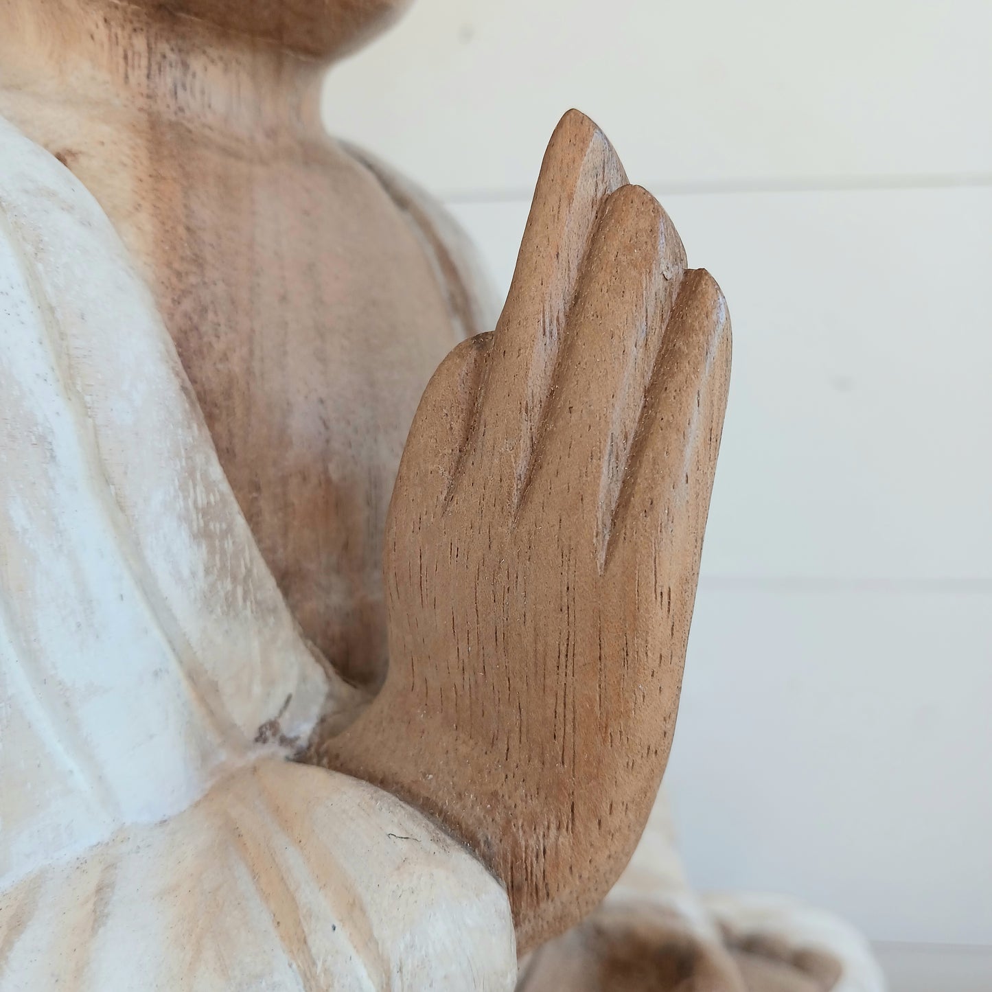 Bring calm, wisdom, and mindful intention into your space with this beautifully serene Teaching Buddha statue, hand-carved from sustainable Suar wood (Albizia Saman), a fast-growing and responsibly cultivated hardwood, finished in whitewash.