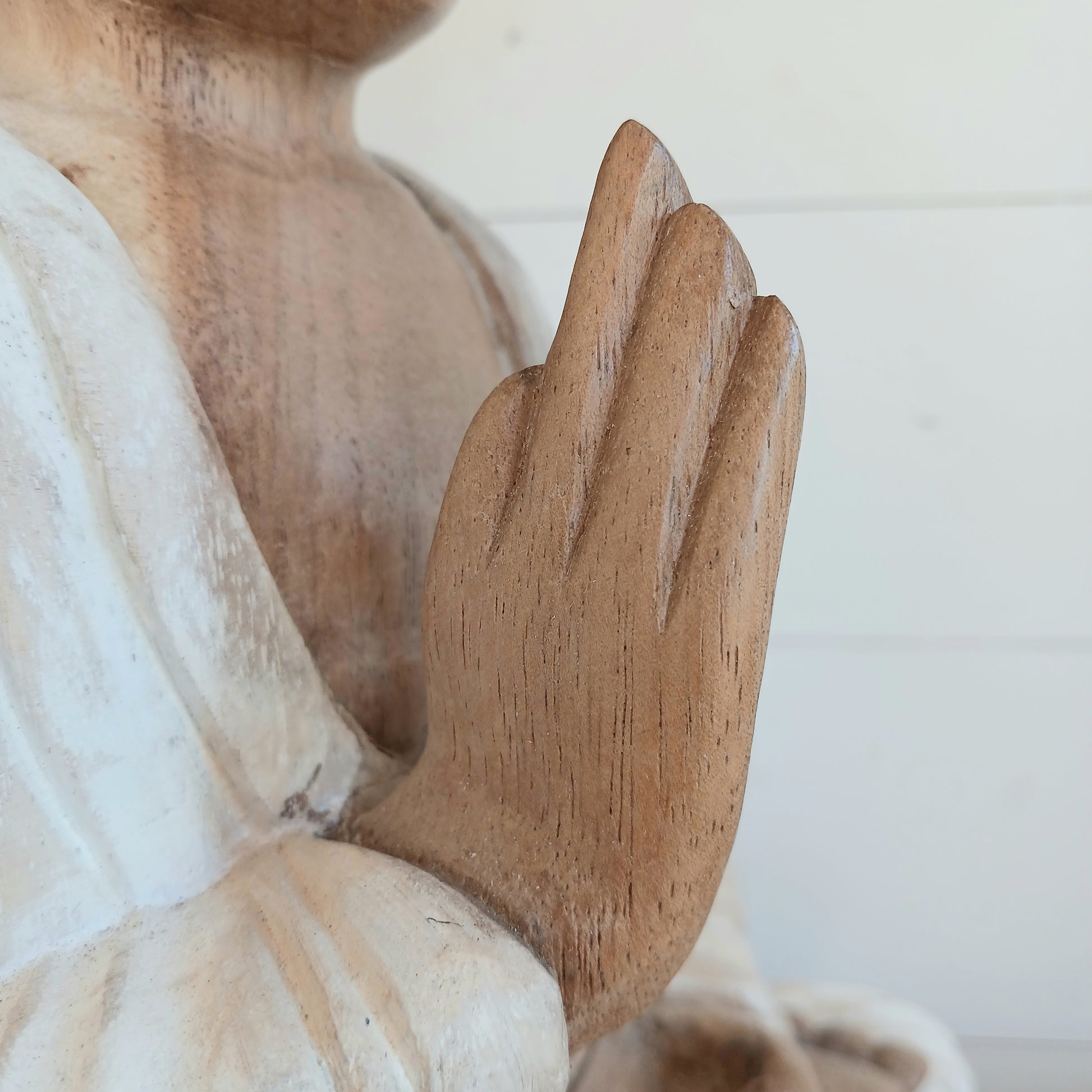 Bring calm, wisdom, and mindful intention into your space with this beautifully serene Teaching Buddha statue, hand-carved from sustainable Suar wood (Albizia Saman), a fast-growing and responsibly cultivated hardwood, finished in whitewash.