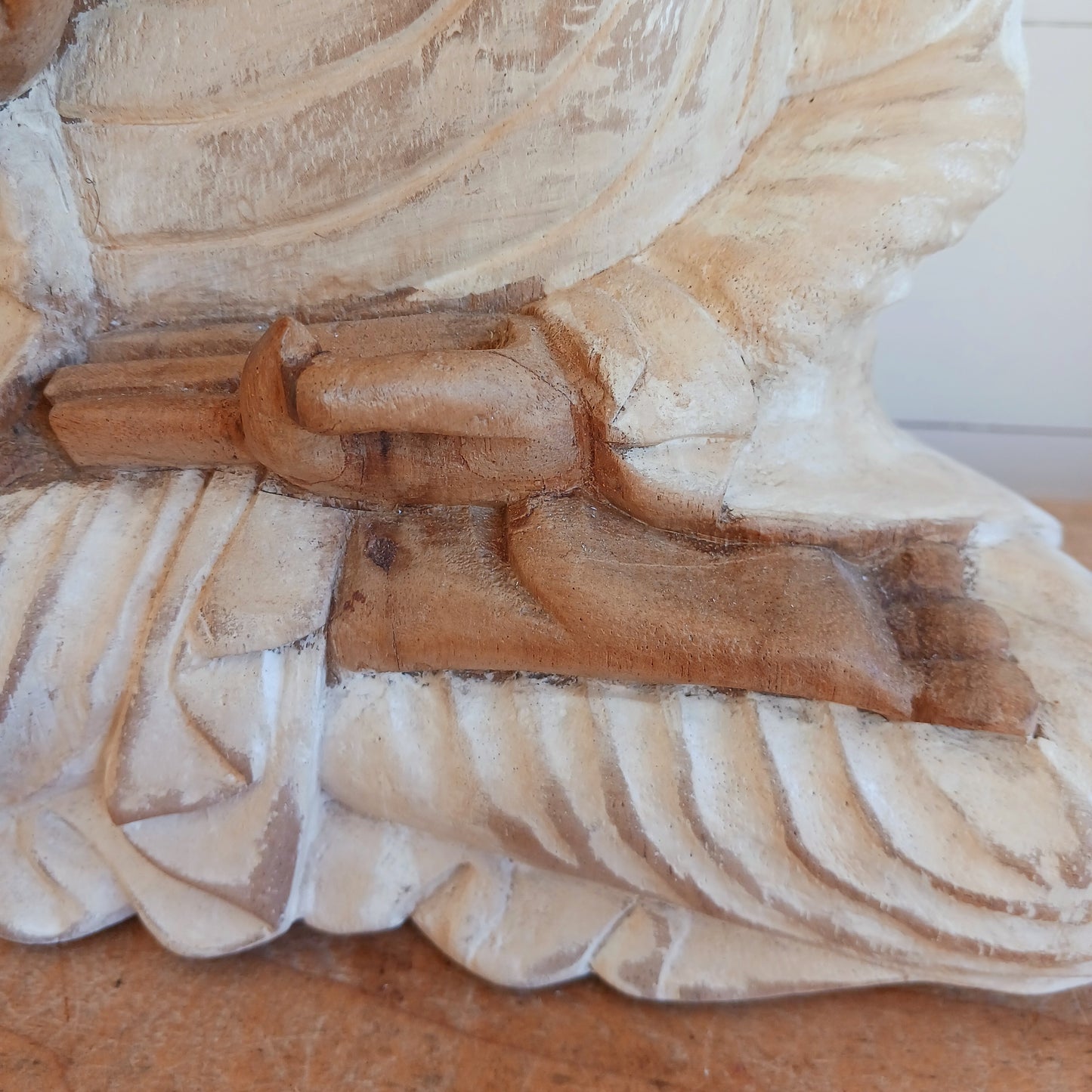 Bring calm, wisdom, and mindful intention into your space with this beautifully serene Teaching Buddha statue, hand-carved from sustainable Suar wood (Albizia Saman), a fast-growing and responsibly cultivated hardwood, finished in whitewash.