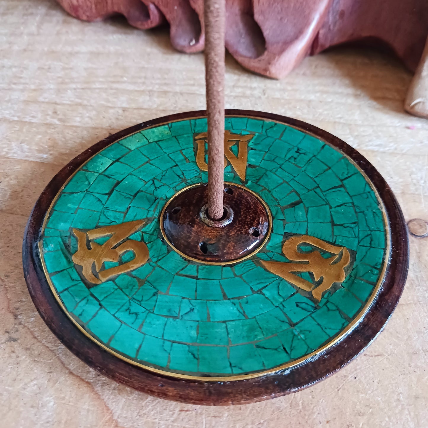 Elevate your meditation, yoga, or relaxation rituals with this hand-crafted Tibetan Om Wooden Incense Burner, skilfully made in Nepal under Fairtrade guidelines. Designed with the sacred Om symbol, this incense holder embodies harmony, mindfulness, and spiritual protection.