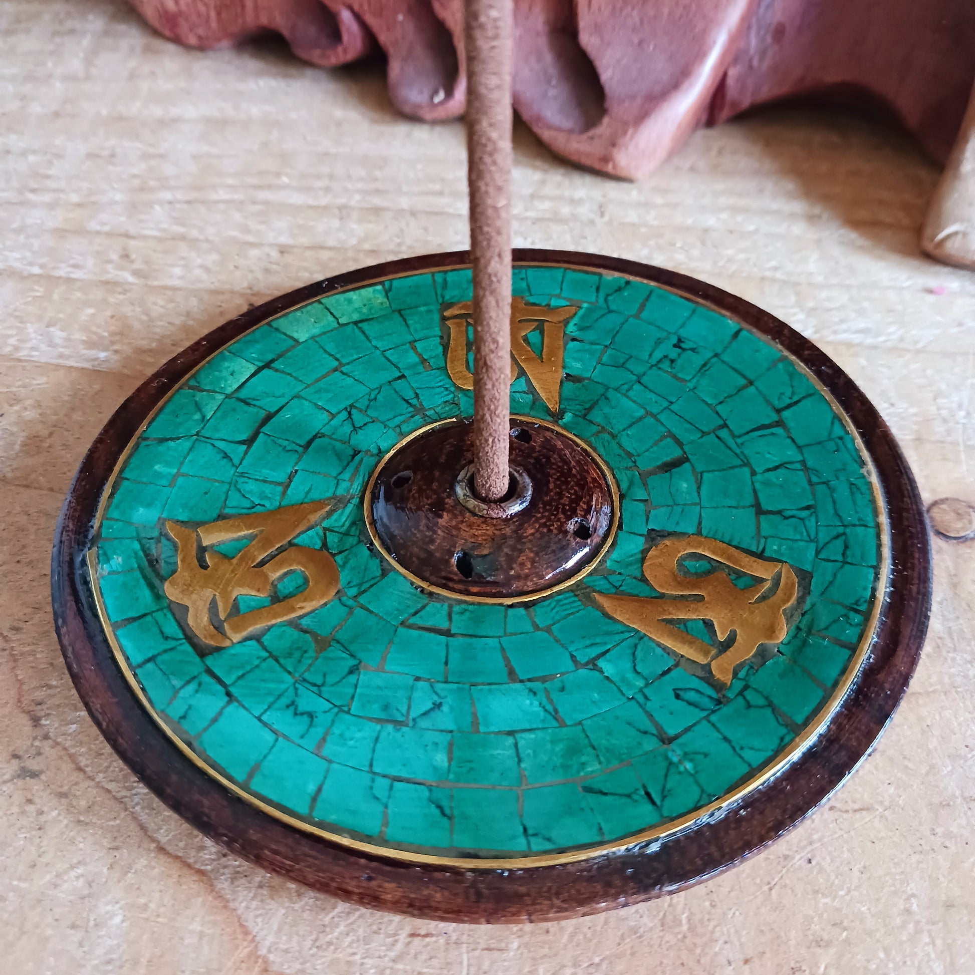 Elevate your meditation, yoga, or relaxation rituals with this hand-crafted Tibetan Om Wooden Incense Burner, skilfully made in Nepal under Fairtrade guidelines. Designed with the sacred Om symbol, this incense holder embodies harmony, mindfulness, and spiritual protection.