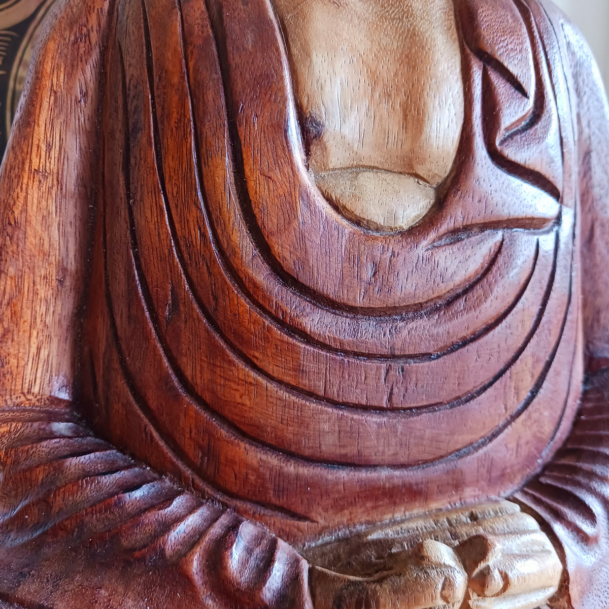 Bring a sense of peace, serenity and mindfulness into your home with this beautiful large Hand Carved Wooden Meditating Buddha Statue. Traditionally crafted in Bali from sustainable Suar wood, each statue is a unique work of art, showcasing the natural beauty of the wood and the skill of the artisan.