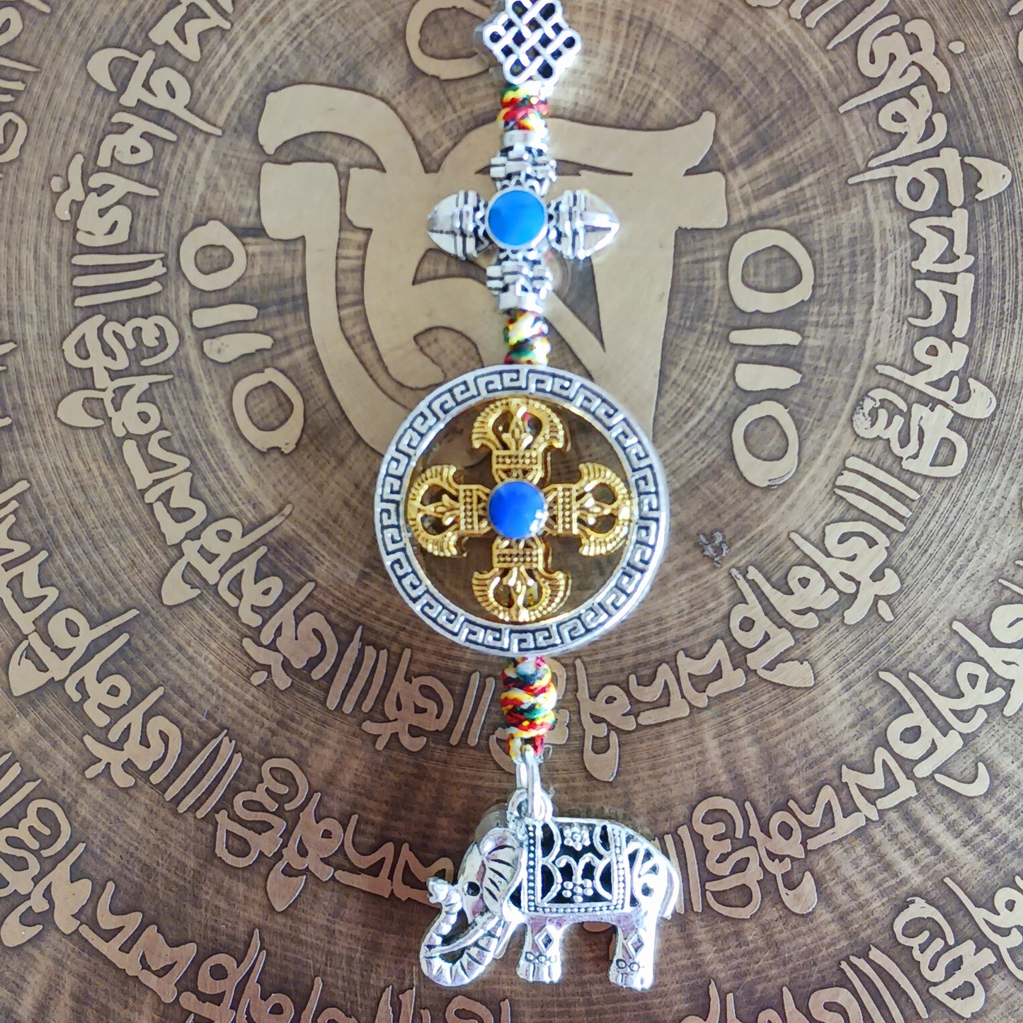 Bring peace, protection, and powerful symbolism wherever you go with this Buddhist protective pendant. Featuring the Double Dorje, a sacred symbol of stability, strength, and protection from fear, and an Elephant, representing the transformation of desire into mindfulness and contentment, this pendant is a meaningful accessory for your car, home, bag, or key ring. Crafted with intention, it's a perfect reminder of your inner strength and spiritual focus.