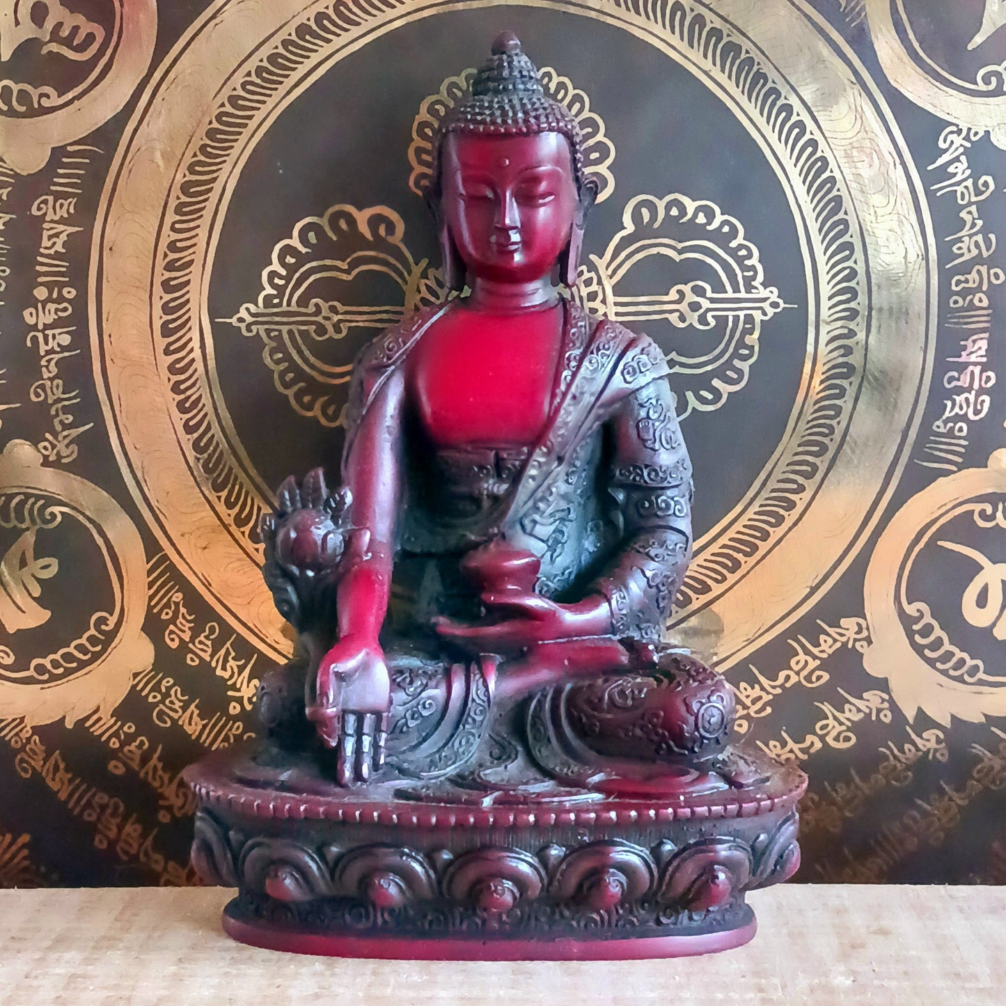Bring the serene power of healing into your space with this large Medicine Buddha statue. Crafted in a deep, rich red colour with intricate detailing, this sculpture represents Bhaisajya Tathagatta, also known as the Healing Buddha.