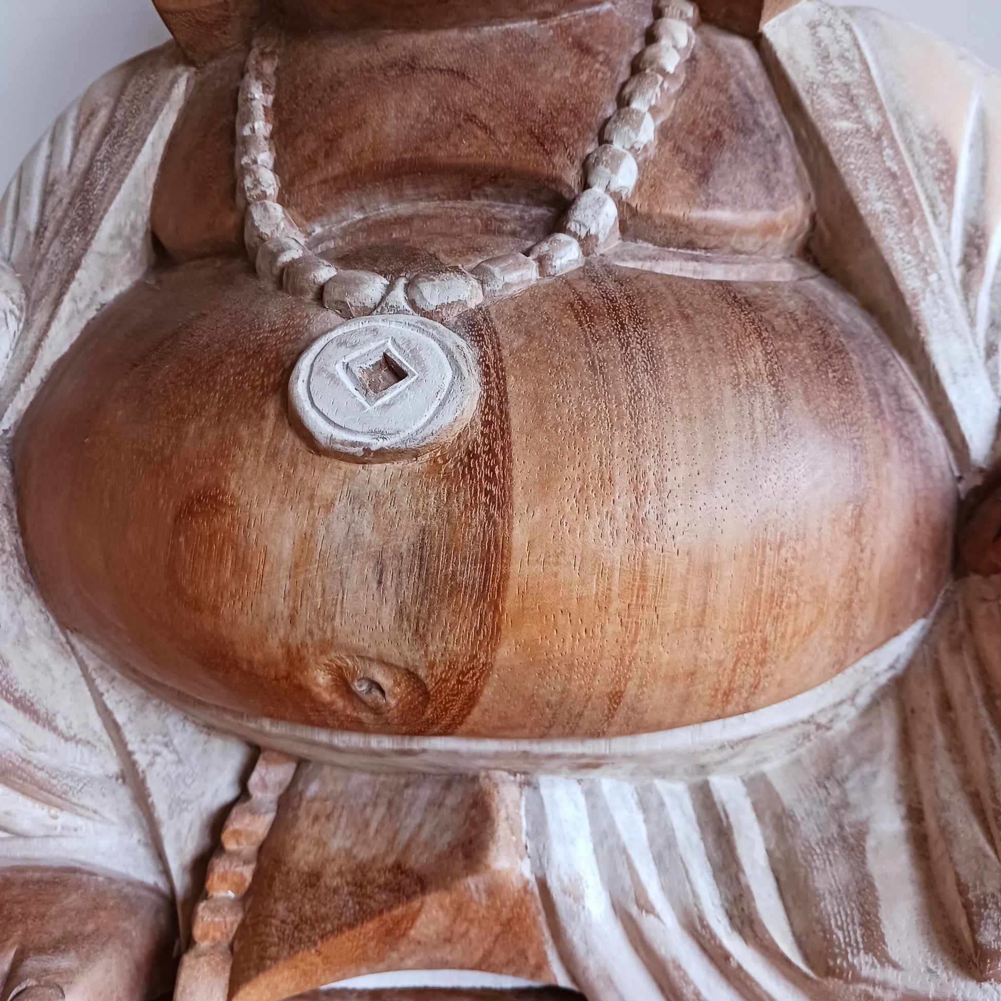 Bring warmth, joy, and calm into your space with this stunning Large Hand-Carved Happy Buddha Statue. Each piece is patiently sculpted by skilled artisans using traditional tools, a process that can take weeks and gives every curve and detail its distinctive character.