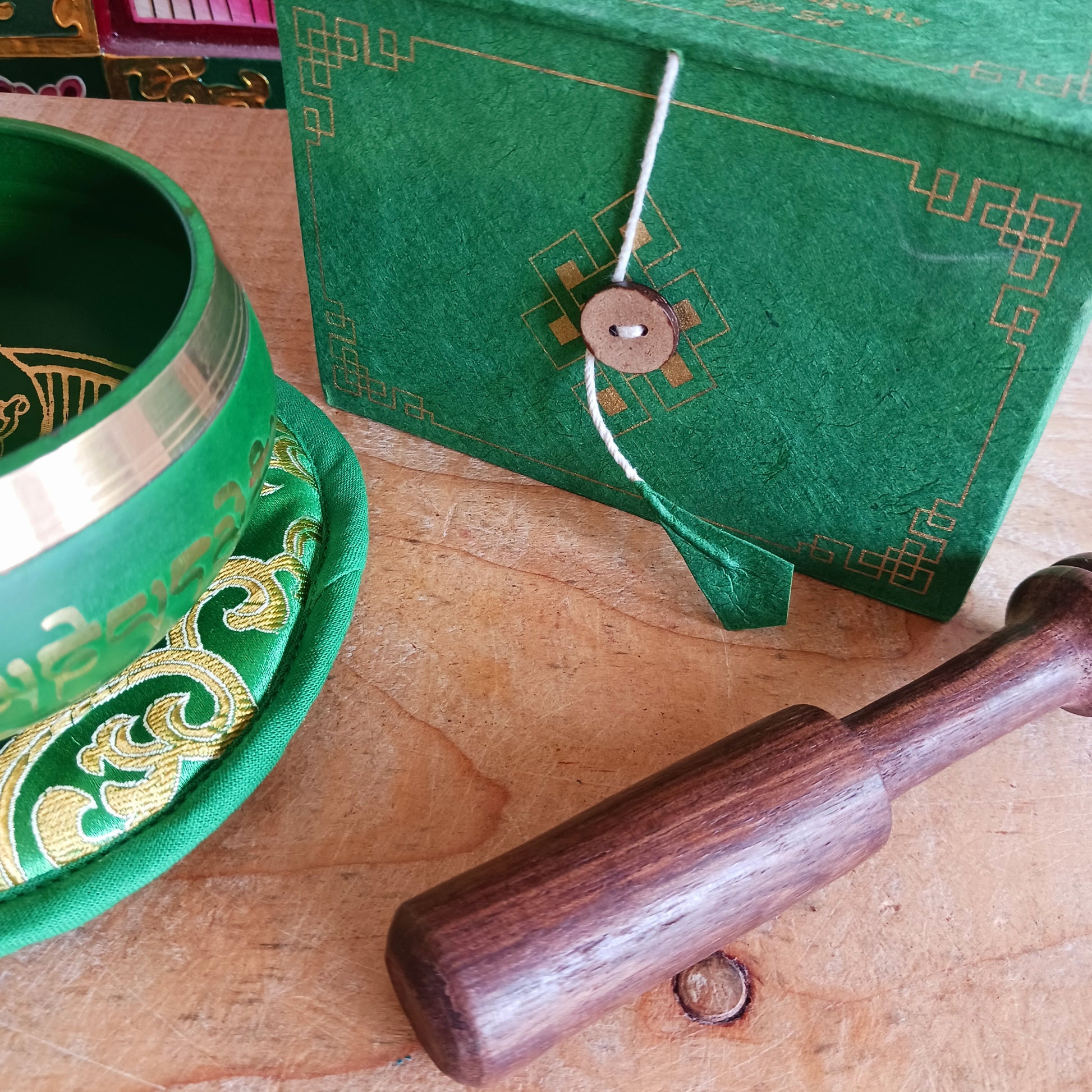 Hand-painted Green Tara singing bowl set with striker & pillow. A sacred gift for meditation, mindfulness, or yoga. Comes in eco-friendly packaging.