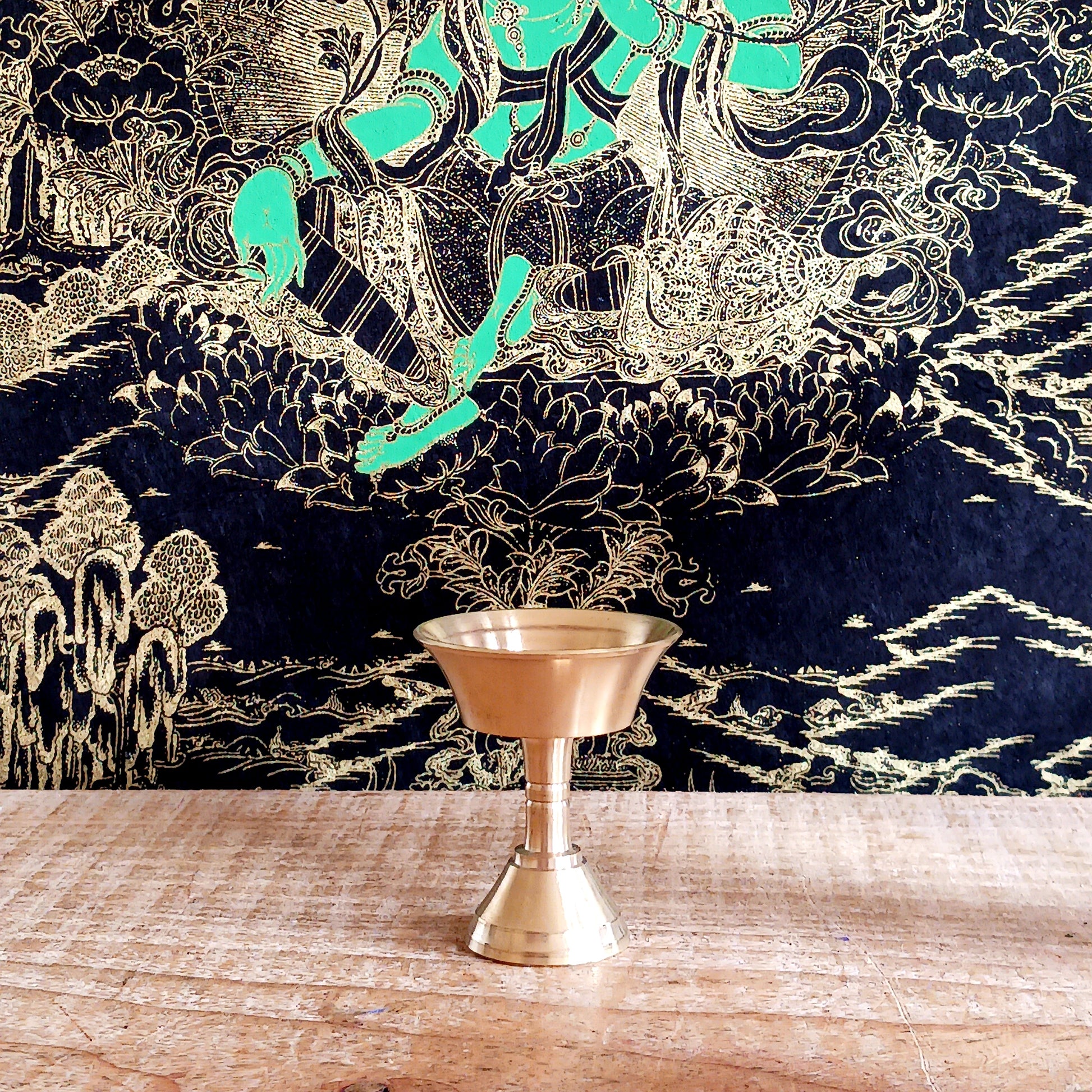 Bring sacred Tibetan tradition into your space with this handcrafted Brass Butter Lamp, a timeless symbol of wisdom and spiritual illumination. Commonly found in Tibetan Buddhist temples and monasteries across the Himalayas, butter lamps are offered each morning to dispel darkness and invite enlightenment.