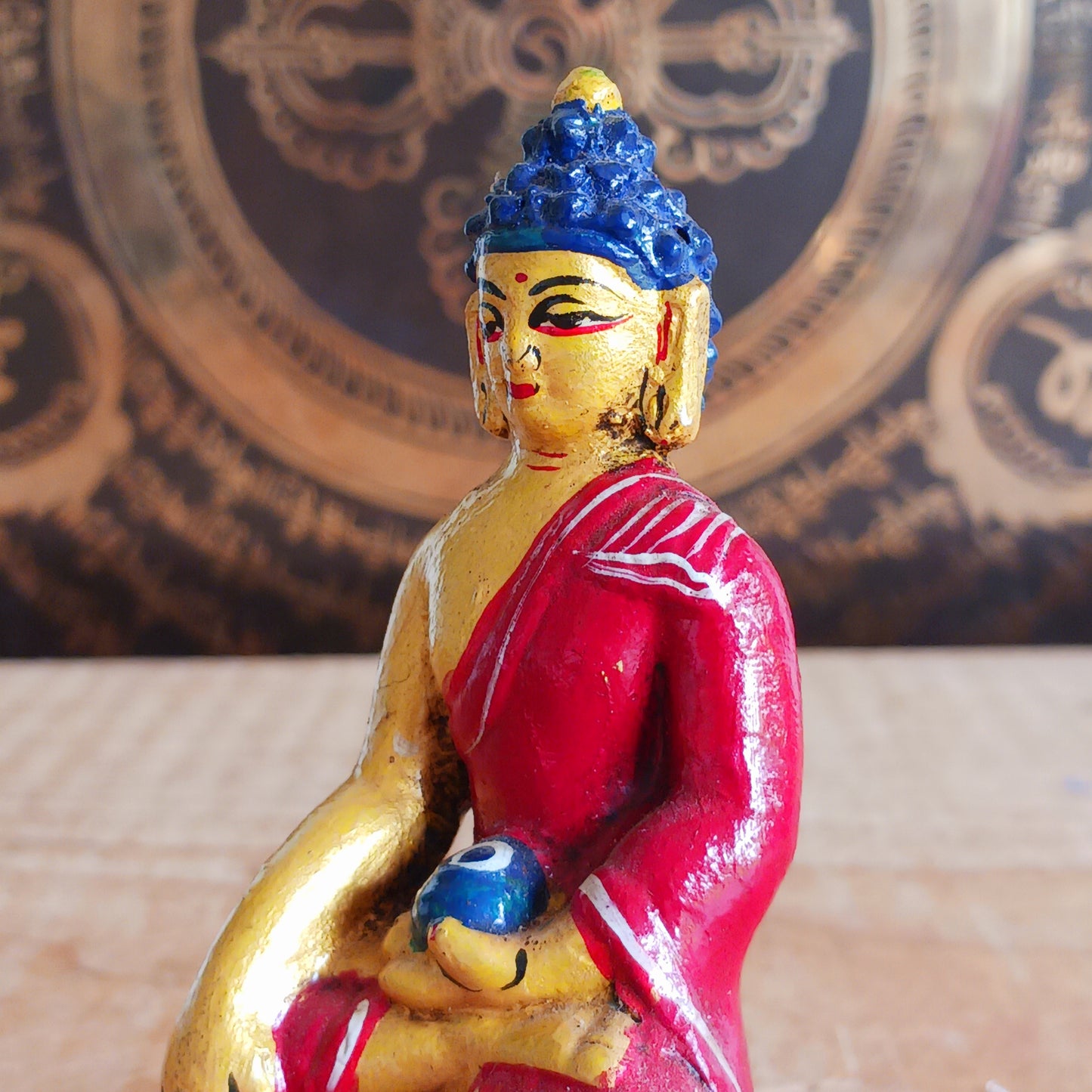 The Medicine Buddha is revered for his power to heal physical and emotional ailments. He is depicted in serene meditation, holding a bowl of healing medicine, making this statue a meaningful addition to any altar, meditation corner, or sacred space.