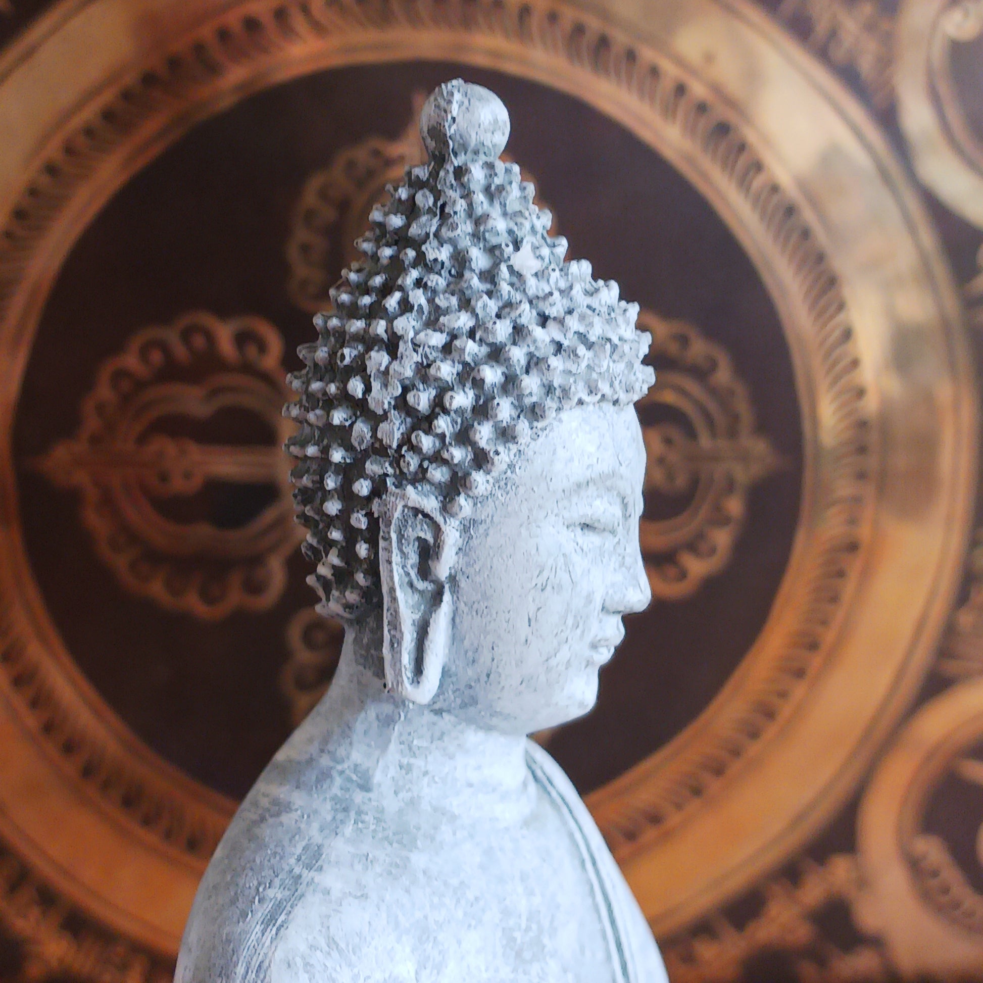 Invite peace and mindfulness into your space with this serene grey Thai-style Buddha statue. Crafted to reflect traditional Thai artistry, this elegant piece features a meditating Buddha seated gracefully on a throne. The calm expression and intricate detailing make it a perfect centerpiece for your home, meditation area, or spiritual altar. Ideal for anyone seeking a touch of tranquility and spiritual inspiration in their décor.