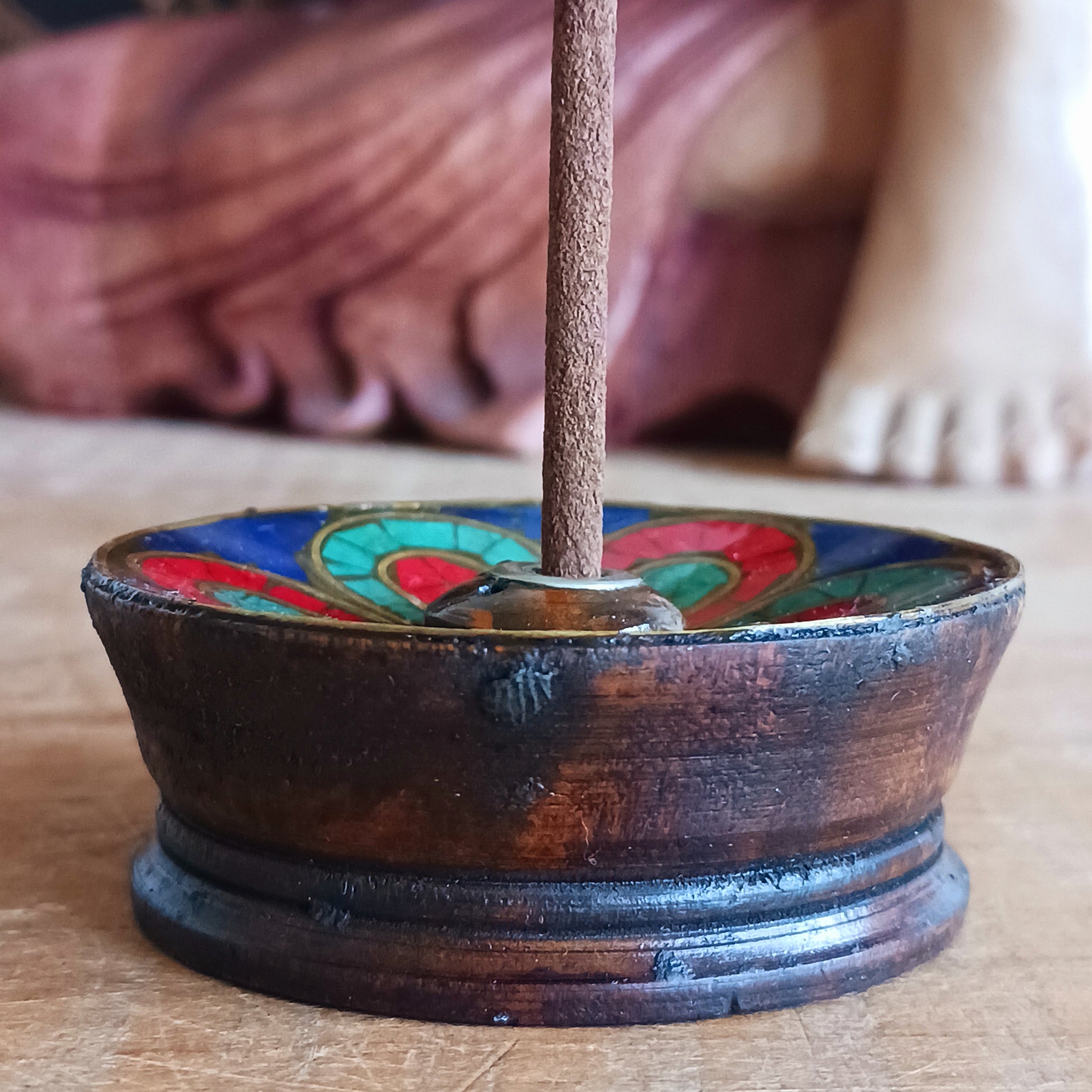 A beautiful Hand painted Tibetan Incense stick holder , Hand painted and ethically sourced this incense Holder is Perfect for the Larger Tibetan Incense it also has 4 small holes for Indian sticks.
