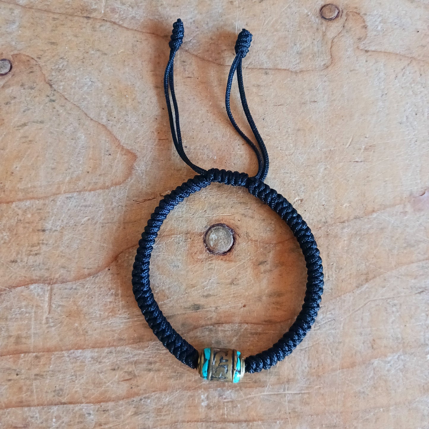 Experience the timeless beauty and spiritual symbolism of this handcrafted Tibetan Mantra Rope Bracelet. Each bracelet is skilfully woven with high-quality braided cord, designed to be durable, lightweight, and comfortable for daily wear.