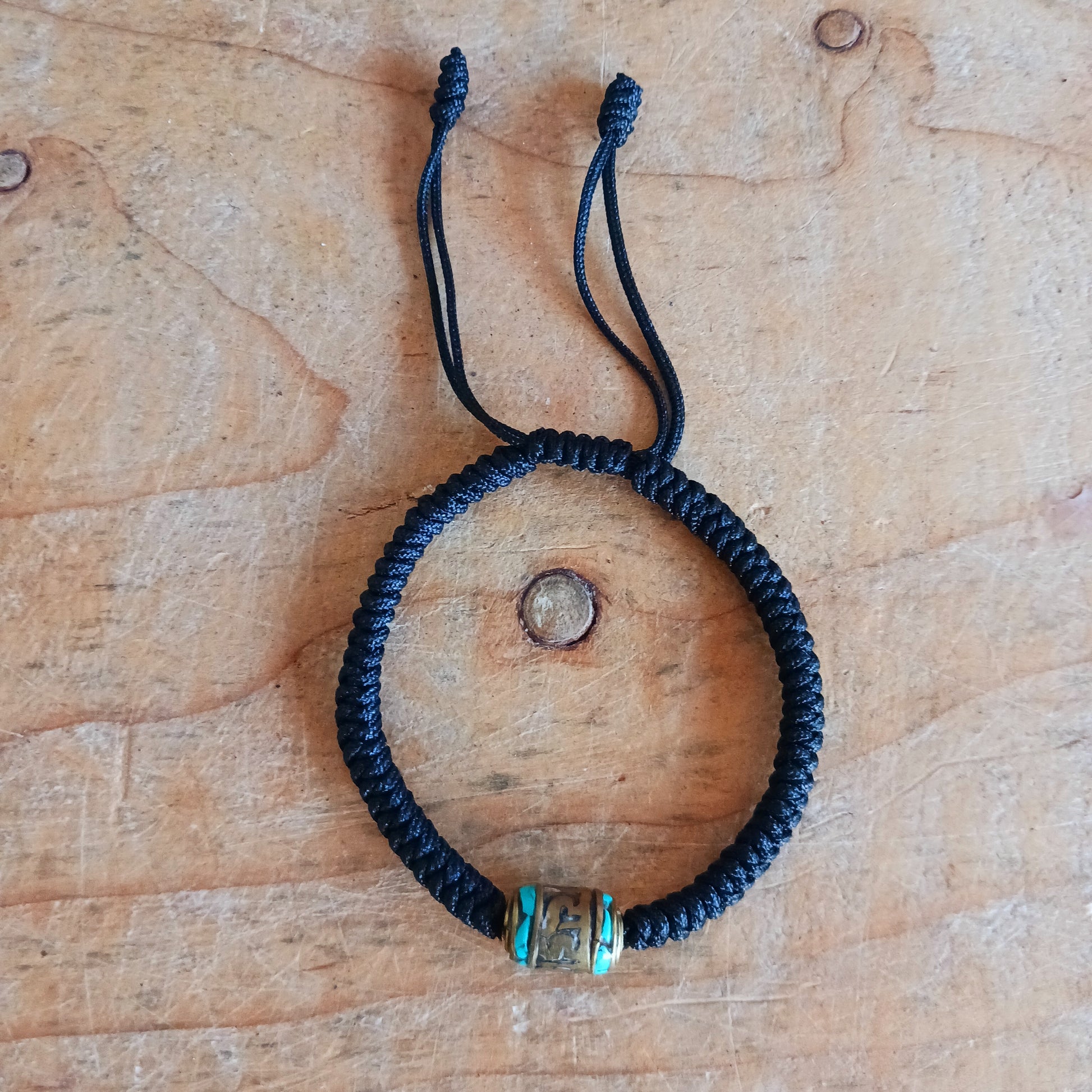 Experience the timeless beauty and spiritual symbolism of this handcrafted Tibetan Mantra Rope Bracelet. Each bracelet is skilfully woven with high-quality braided cord, designed to be durable, lightweight, and comfortable for daily wear.