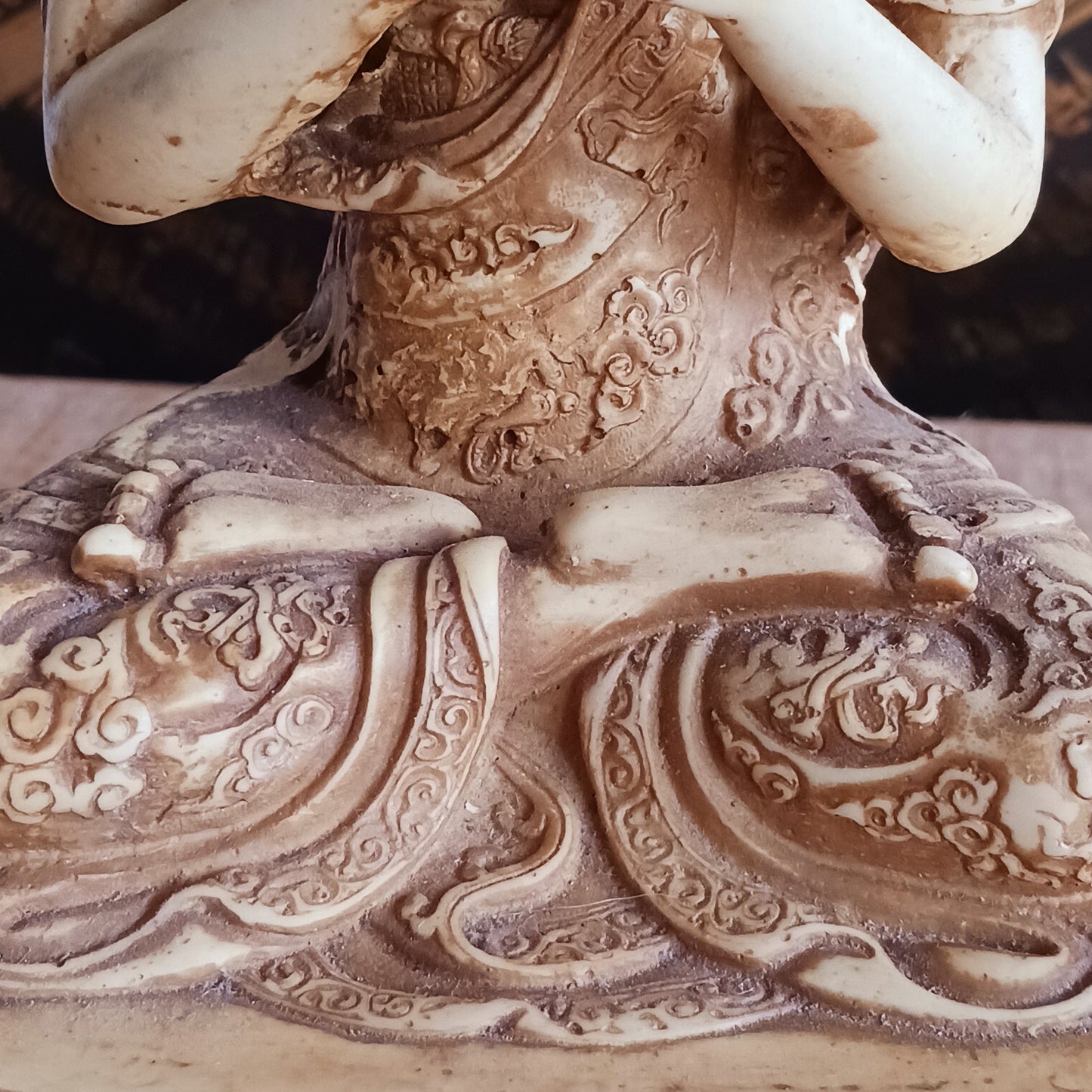 Bring serenity and wisdom into your space with this large, intricately detailed Buddha statue. Cast in a deep sand colour, this statue depicts the Buddha in the Dharmachakra Mudra — the "Wheel of Dharma" gesture. 