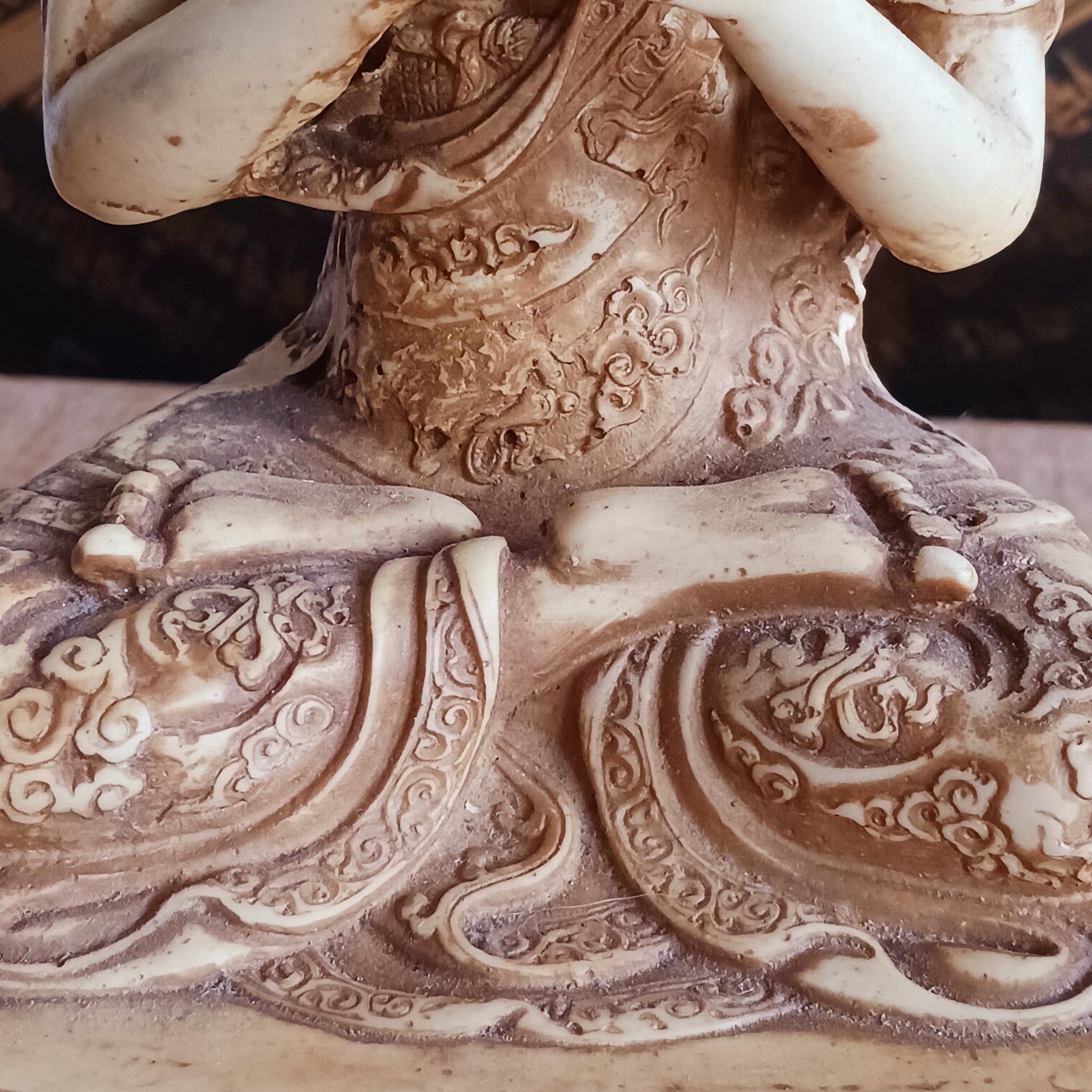 Bring serenity and wisdom into your space with this large, intricately detailed Buddha statue. Cast in a deep sand colour, this statue depicts the Buddha in the Dharmachakra Mudra — the "Wheel of Dharma" gesture. 