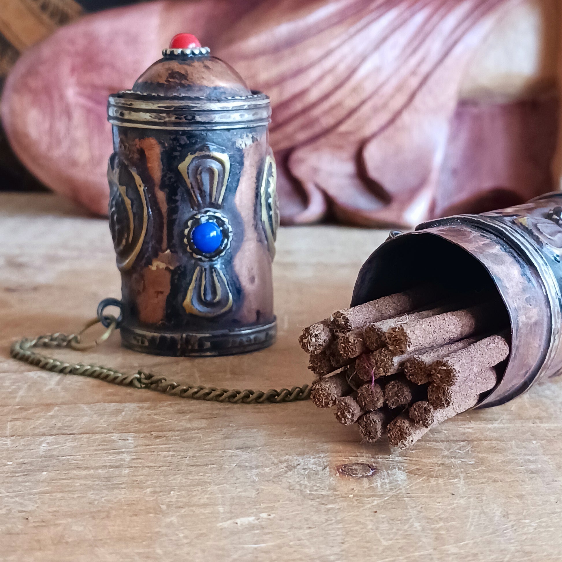 Introducing the Dorje Tibetan Incense Holder, a meticulously handcrafted ritual accessory designed to elevate your incense experience. This exquisite incense holder is not only a functional storage solution but also a captivating piece of art. Carefully crafted and adorned with brass dorjes and auspicious symbols, it exudes a sense of spiritual elegance.