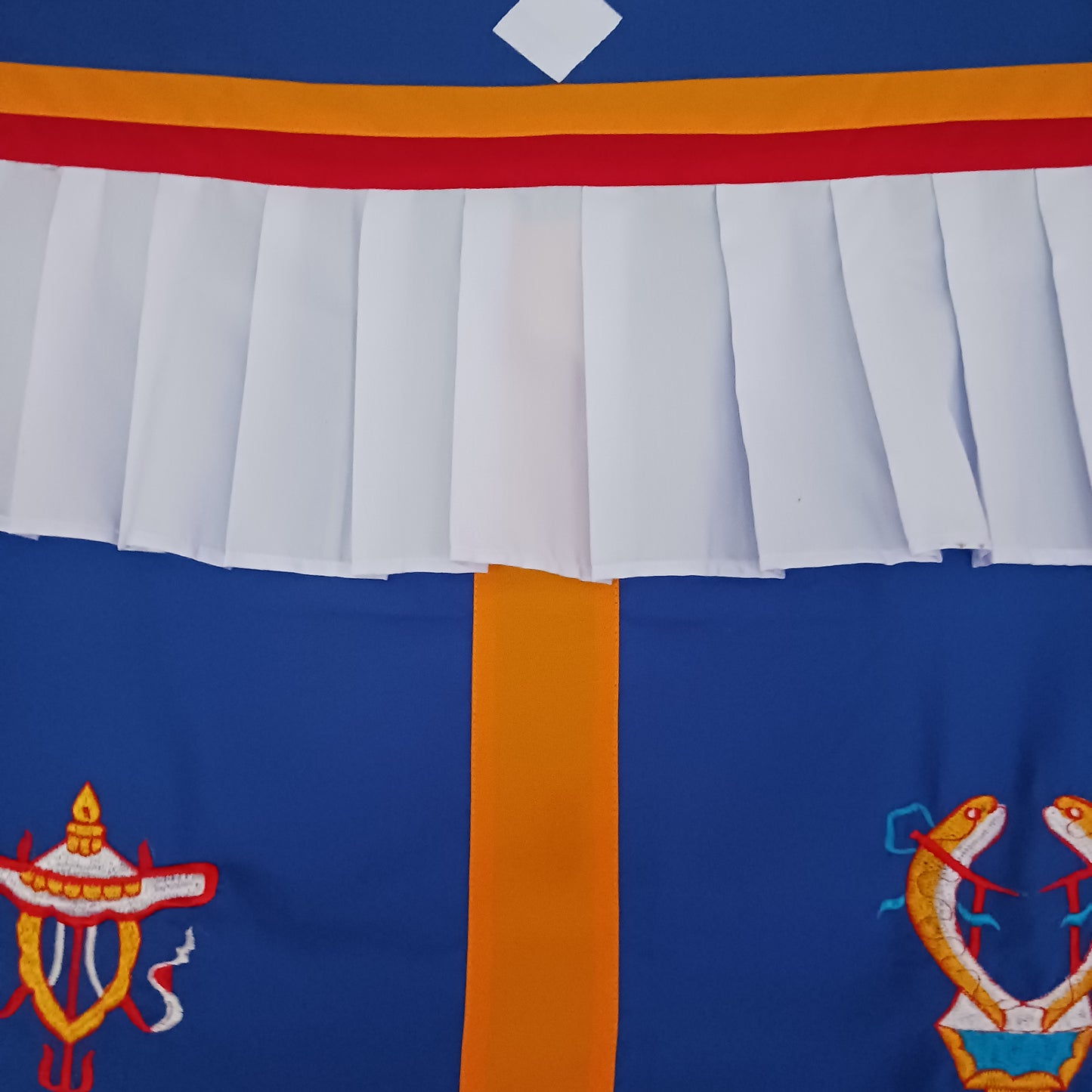 Bring harmony, beauty, and traditional craftsmanship into your space with this hand-embroidered Tibetan Buddhist door curtain, adorned with the sacred Eight Auspicious Symbols, also known as The Eight Jewels. Each symbol is intricately stitched to represent blessings of prosperity, protection, wisdom, and spiritual awakening.