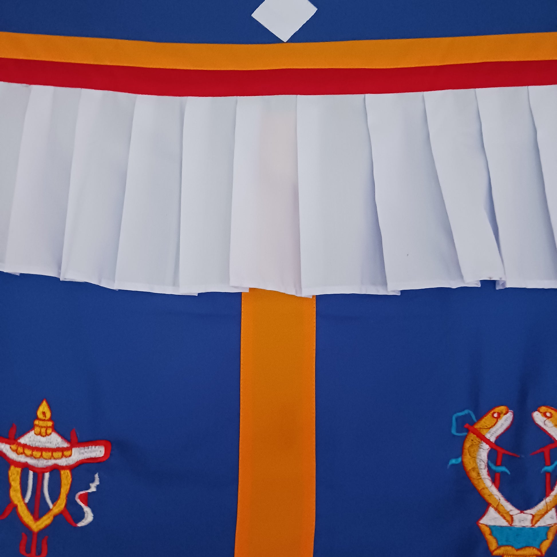 Bring harmony, beauty, and traditional craftsmanship into your space with this hand-embroidered Tibetan Buddhist door curtain, adorned with the sacred Eight Auspicious Symbols, also known as The Eight Jewels. Each symbol is intricately stitched to represent blessings of prosperity, protection, wisdom, and spiritual awakening.