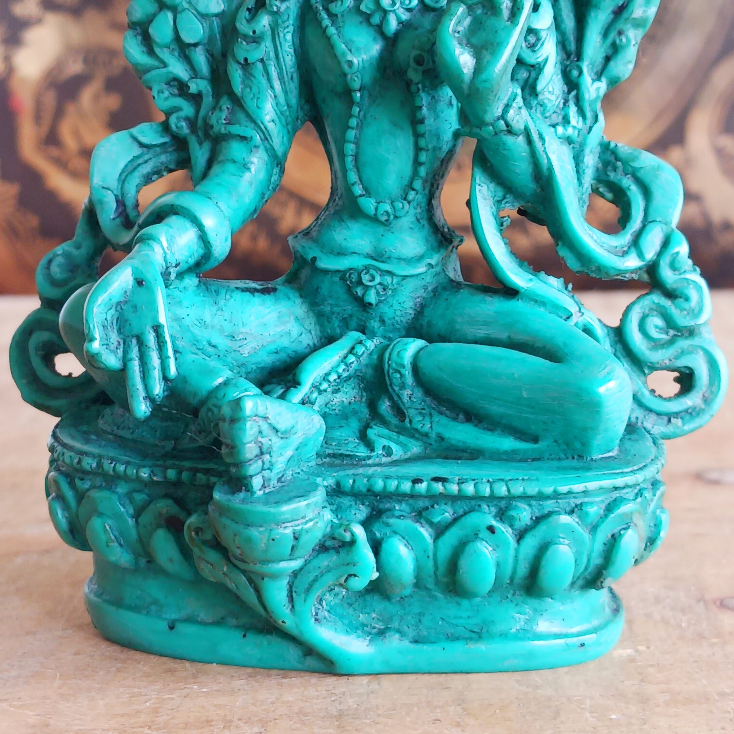 This beautiful and bold green resin statue depicts Green Tara, the revered Buddhist goddess of compassion, protection, and swift action.