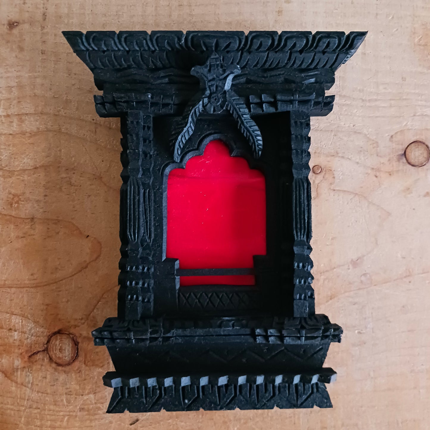 This beautifully intricate, hand carved wooden Tibetan window, is 100% Nepali Fairtrade product. The history of wooden handicrafts of Nepal can be traced to antiquity. Traditional designs used in doors and windows of houses and temples now are made for home decor, like this ornately hand carved a window. 