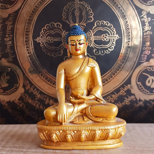 Bring serenity and spiritual elegance into your space with this stunning Shakyamuni Buddha statue. Crafted from durable clay and resin, it is meticulously painted in rich gold and traditional thangka colours, following the authentic colour patterns described in ancient texts.