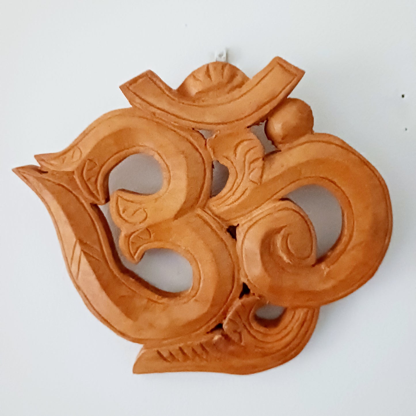 Bring peace, harmony, and divine energy into your home with this handmade Wooden Om Wall Hanging, crafted from sustainably sourced wood. Featuring the sacred Om symbol, this piece blends hand crafted artistry with deep spiritual meaning.