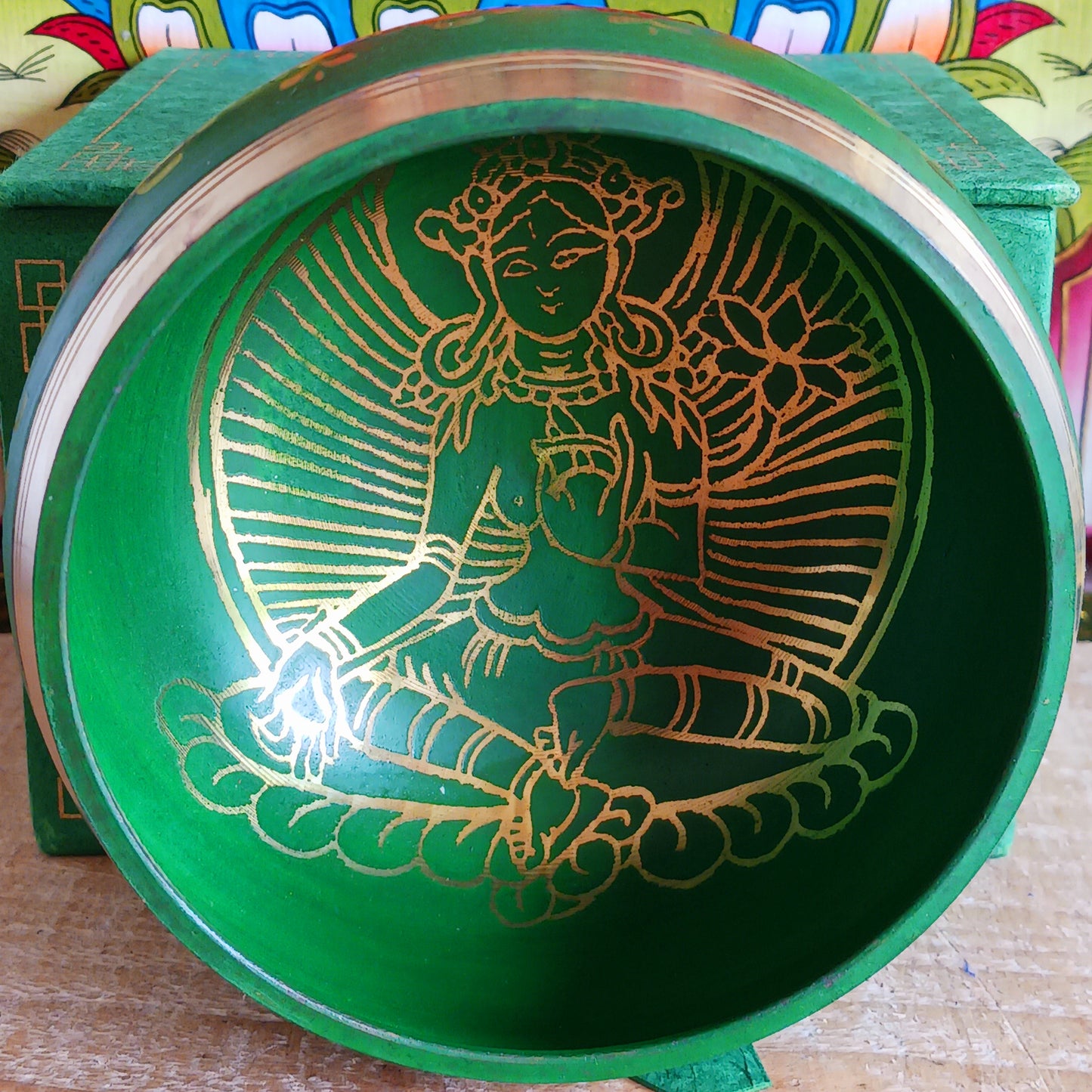 Hand-painted Green Tara singing bowl set with striker & pillow. A sacred gift for meditation, mindfulness, or yoga. Comes in eco-friendly packaging.