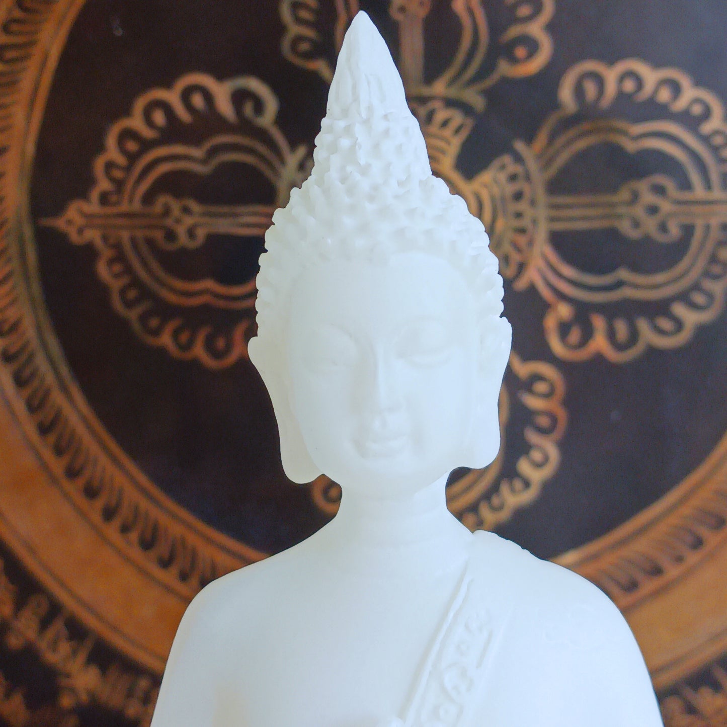 Bring serenity and spiritual symbolism into your sacred space with this beautifully crafted 16cm White Buddha Statue, complete with an Amrita vase. Handmade in Tibet, this statue reflects traditional Buddhist artistry and carries deep meaning rooted in ancient Sanskrit.