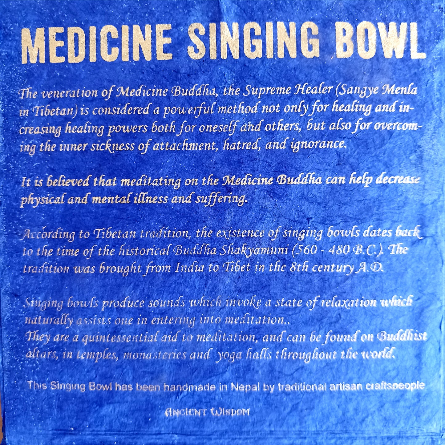 Elevate your practice with a hand-hammered Medicine Buddha singing bowl set, complete with cushion, striker, and symbolic gift box.